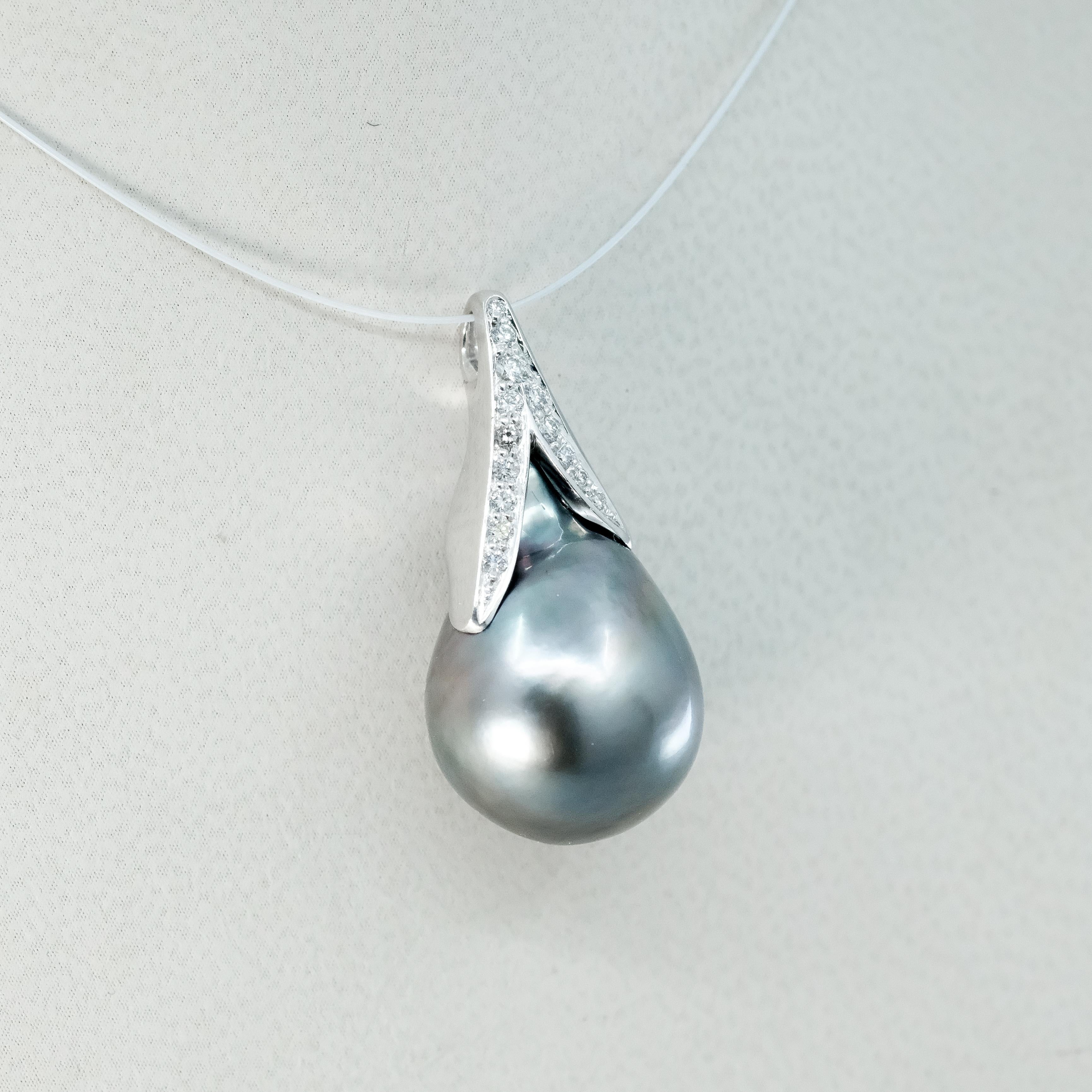 A BUNDA 'Caelum' Cultured Tahitian pearl and Diamond Pendant in 18 carat white gold, featuring a baroque shaped Tahitian pearl, set with a diamond threadset cap that follows the curve of the pearl.

The pearl measures approximately 15.00 - 22.98mm,