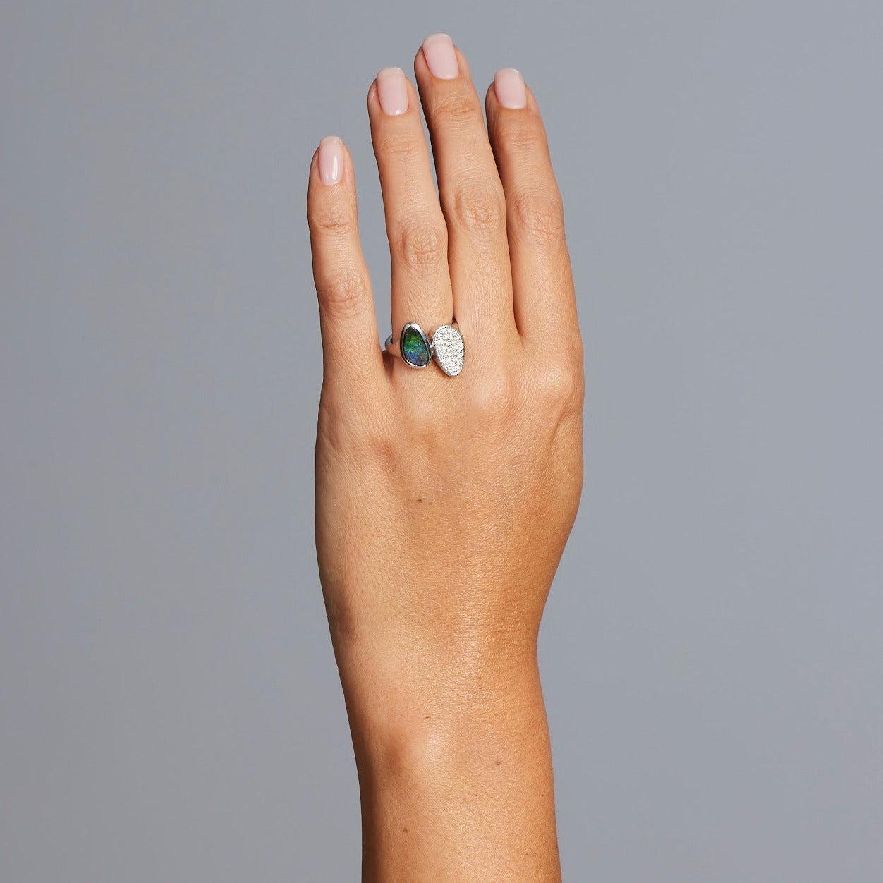 A BUNDA 'Couture' ring handcrafted in 18ct white gold, featuring a bezel set, Australian boulder opal and pave set, round brilliant cut diamonds.

Characteristics of Opal: 1 = 1.87ct. Origin: Queensland, Australia.

Characteristics of diamonds: 30