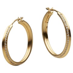 BUNDA, boucles d'oreilles en or jaune 18 carats serties de 0,48 carat de diamants.