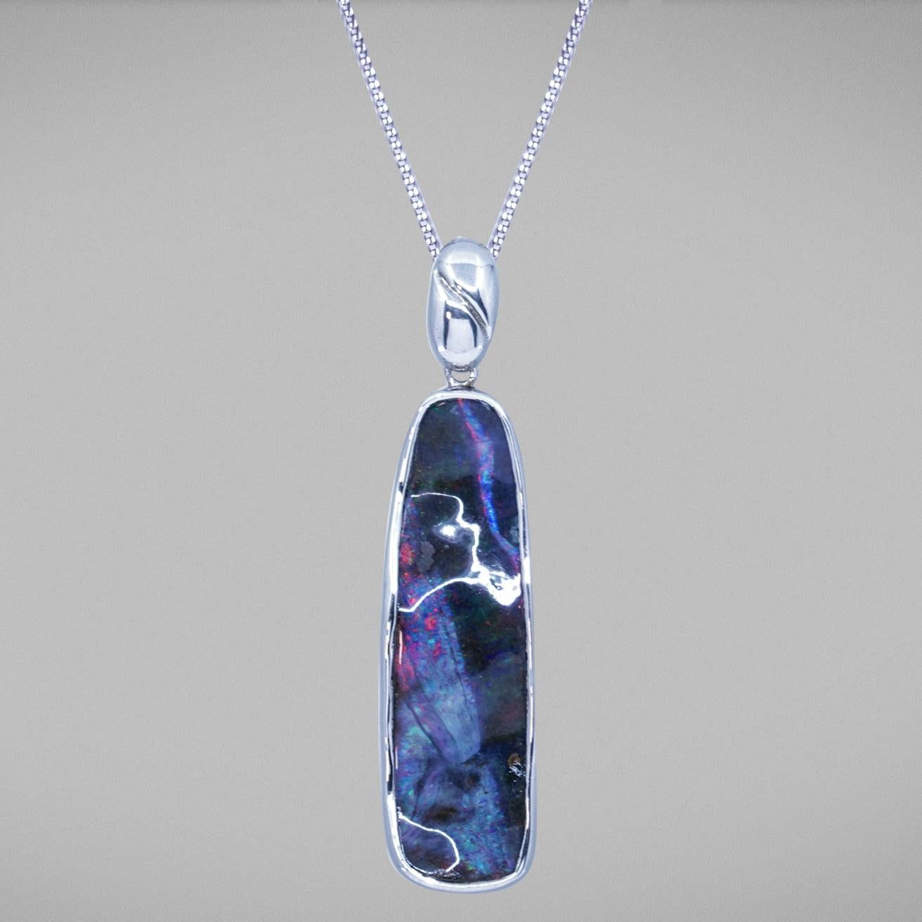 A BUNDA 'Couture' Boulder Opal pendant in sterling silver, featuring an Australian boulder opal, predominately blue, red and brown in colour.

The Queensland Boulder opal weighs 24.21ct.

The chain is sold separately.