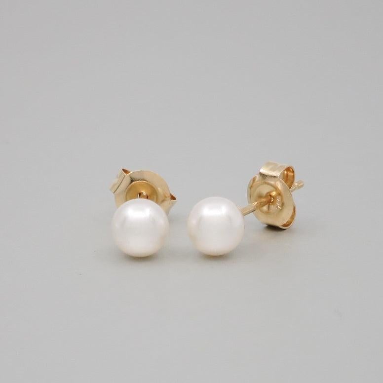 Pair of Akoya pearls 5-6mm set on 18 carat yellow posts and butterfly fittings.
