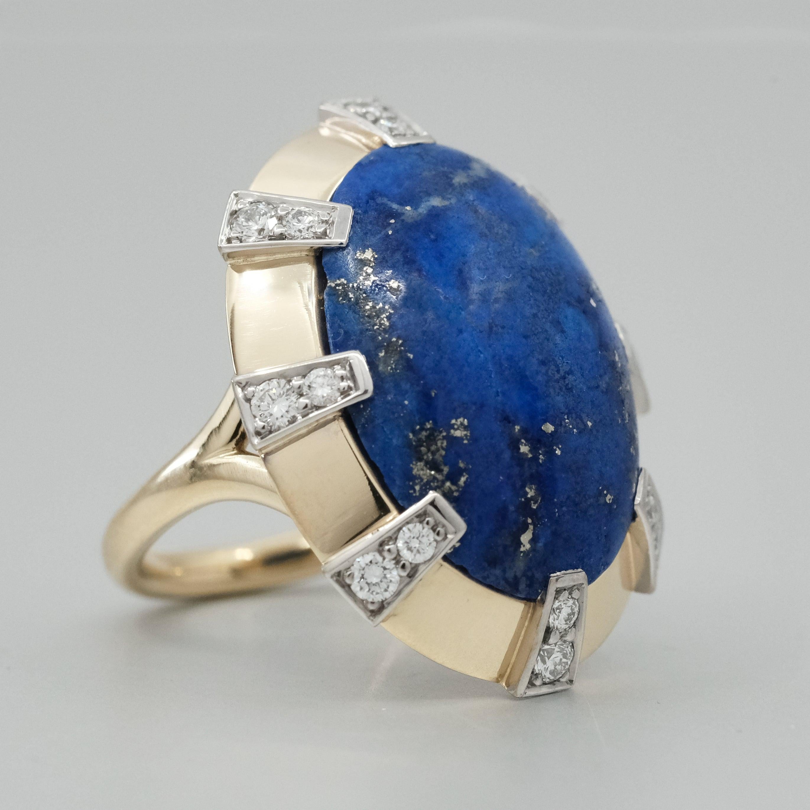 A BUNDA 'Apus' Lapis Lazuli Ring set in 18ct white and yellow gold. Ring size M 1/2. Signed BUNDA.

Characteristics of the Lapis Lazuli: 9.84 carats.

Characteristics of the Diamonds: 0.43 carats, F/VS.

Weight 11.27 grams.