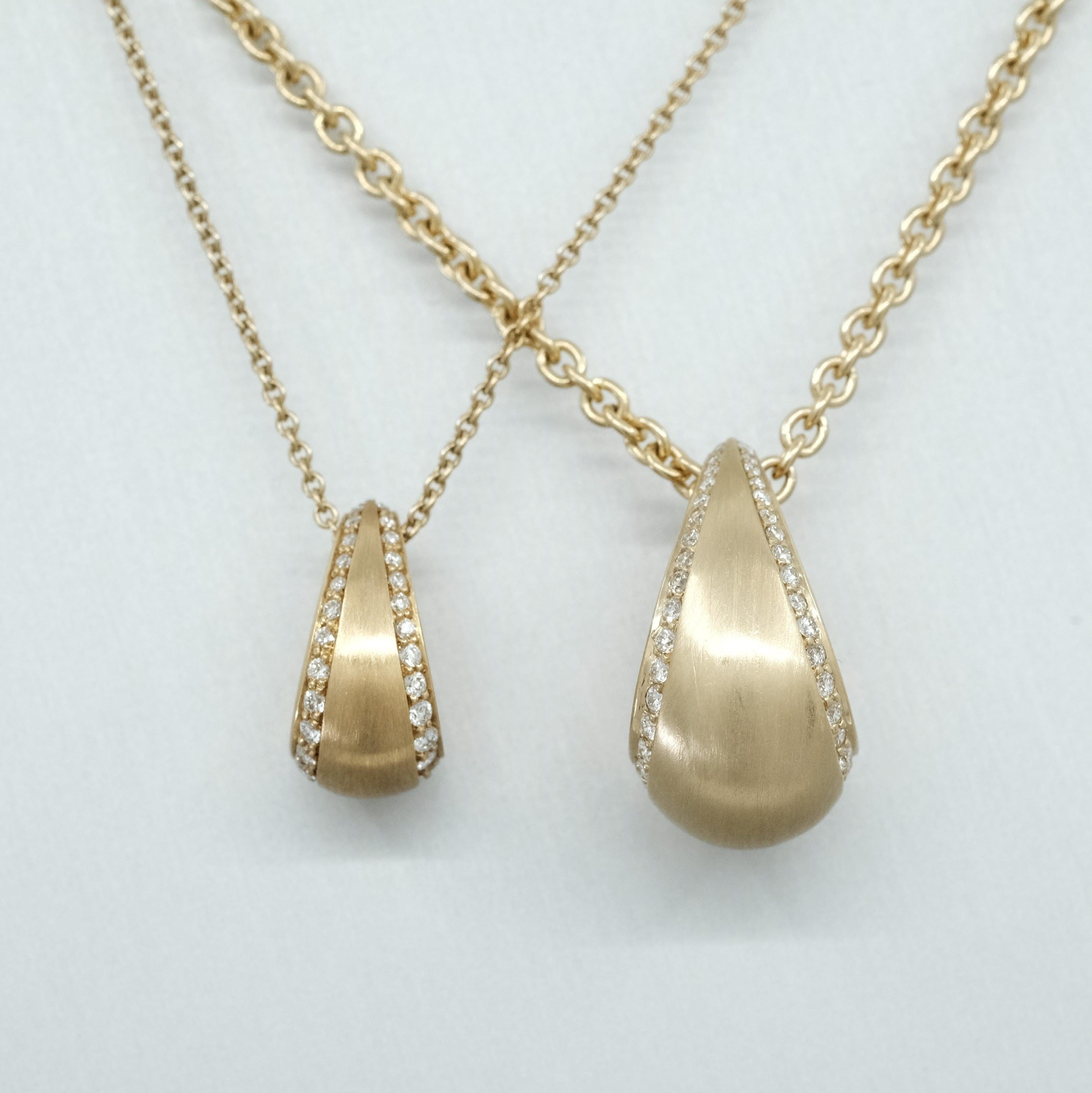 A BUNDA 18 carat yellow gold 'Bundova' pendant set with round brilliant cut diamonds, on an 18 carat yellow gold 'Trace' chain.

Chain Length 42.5cm

Characteristics of Round Brilliant Cut Diamonds: 70 = 0.46ct - F colour, VS Clarity