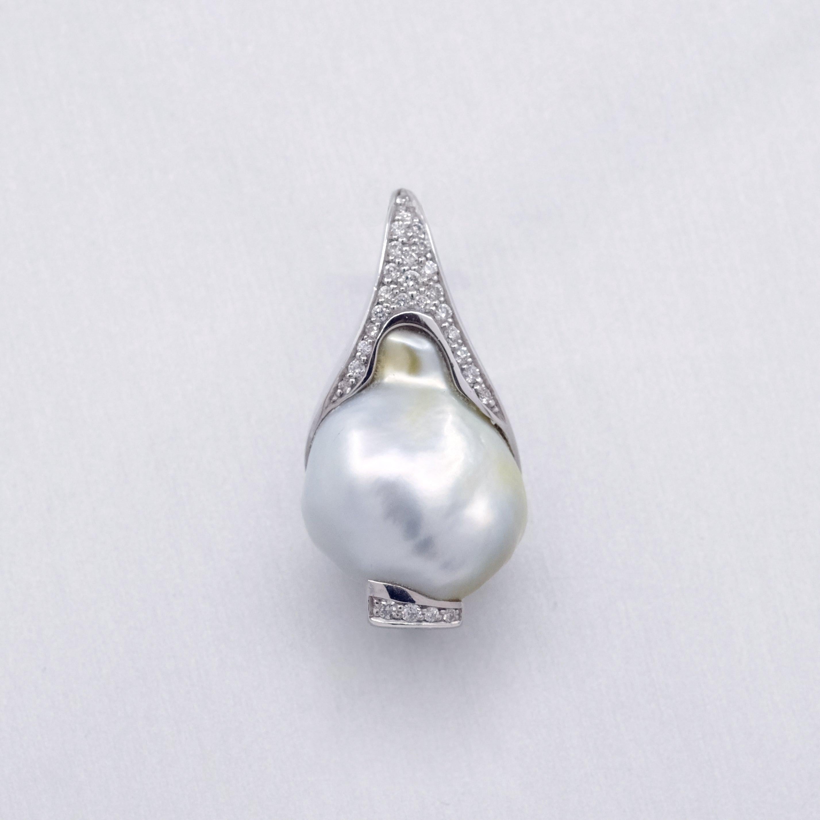 A BUNDA 'Caelum' Cultured South Sea Keshi pearl and Diamond Pendant in 18 carat white gold, featuring a baroque shaped Keshi pearl, set with a diamond threadset cap that follows the curve of the pearl.

The Keshi pearl measures approximately 15.19 -