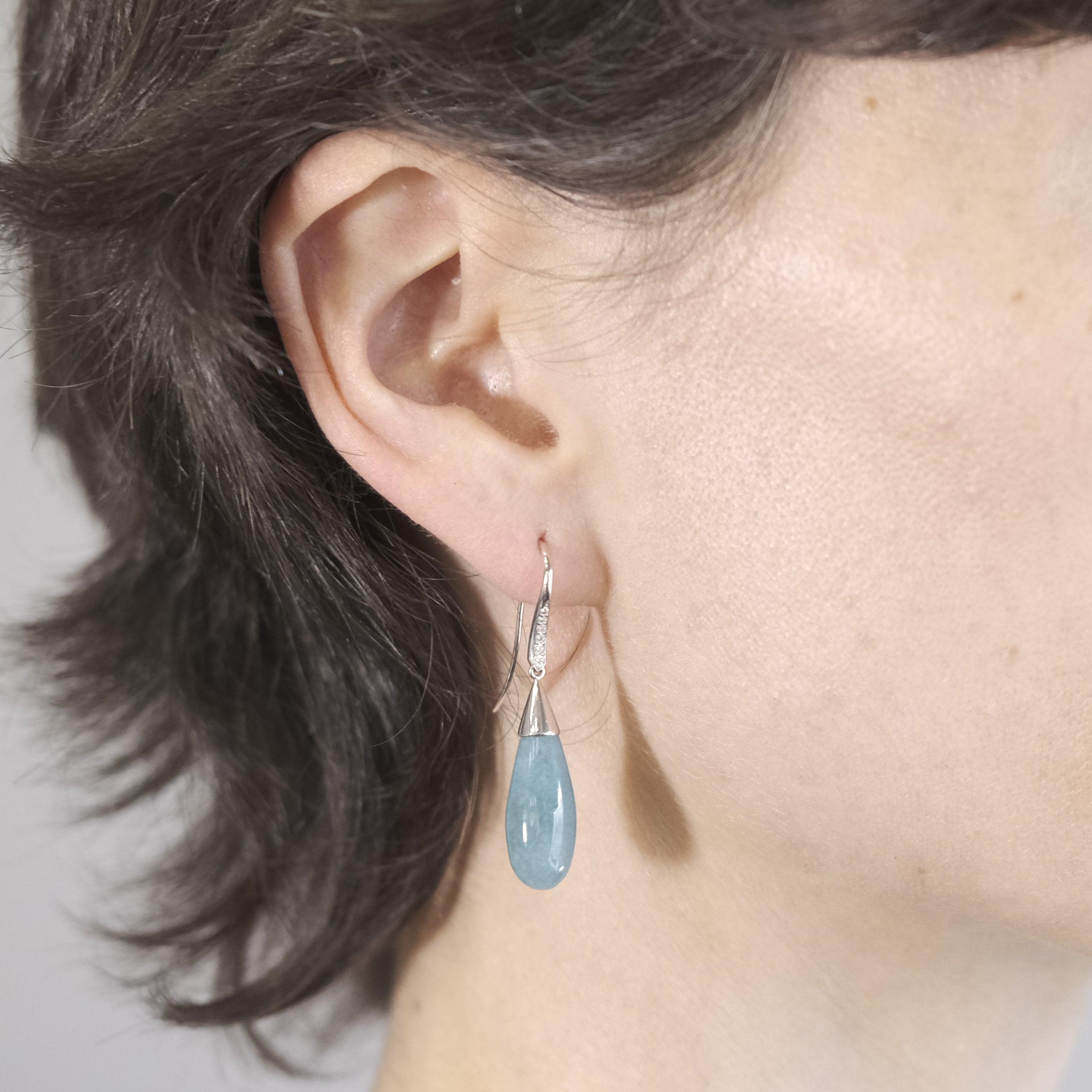 A pair of BUNDA 'Vine' Chalcedony earrings in 18 carat white gold , set with drop shaped, green Chalcedony, with a hand crafted cap, fitted with a diamond set hook.

Weight of Chalcedony: 2 = 25.30ct

Characteristics of diamonds: 12 = 0.09ct, F