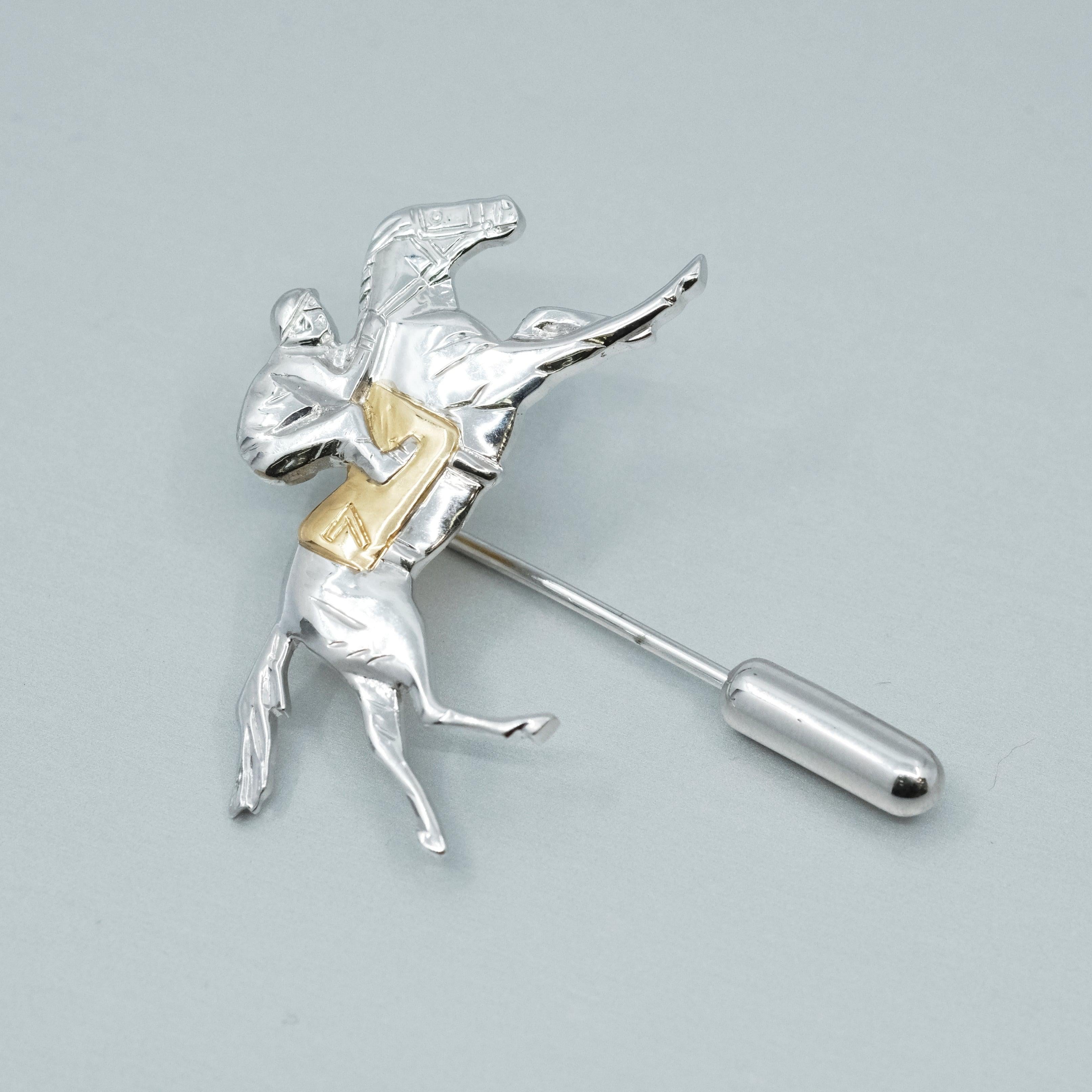 A BUNDA Equestrian Gold pin, 18ct yellow and white gold.


Weight 5.17 grams