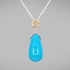 Ciondolo BUNDA 'Hollywood' in turchese 18ct con diamanti su oro giallo 18k