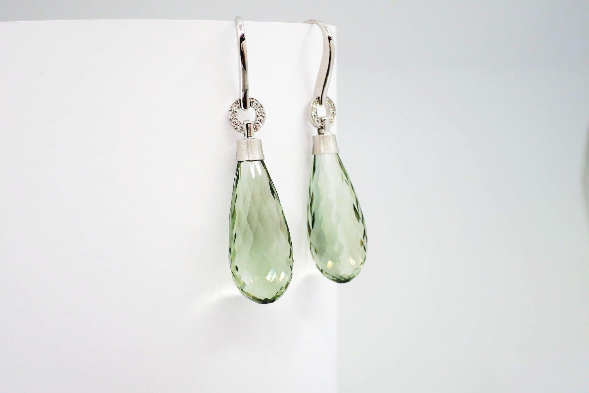 A pair of BUNDA 'Hollywood' prasiolite and diamond earrings in 18ct gold, featuring briolette green prasiolite drops fitted with a hand carved cap and hollywood diamond set hooks.

Characteristics of diamonds: 16 = 0.09ct, F colour, VS