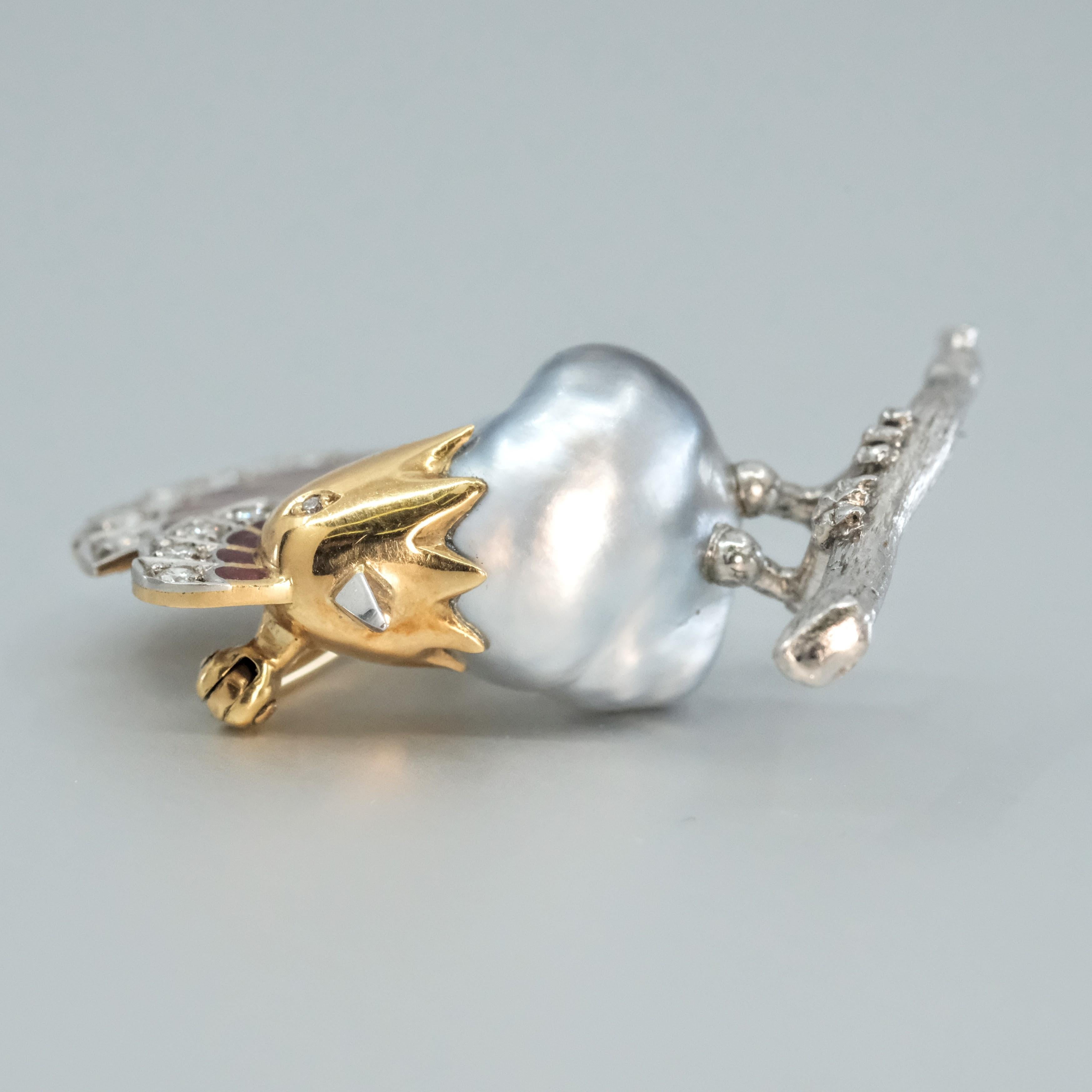 A BUNDA Cultured Tahitian Keshi pearl and enamel rooster brooch in 18-carat yellow gold and platinum, set with round brilliant cut diamonds and a grey baroque shaped Tahitian Keshi pearl of clean skin and excellent lustre with silver
