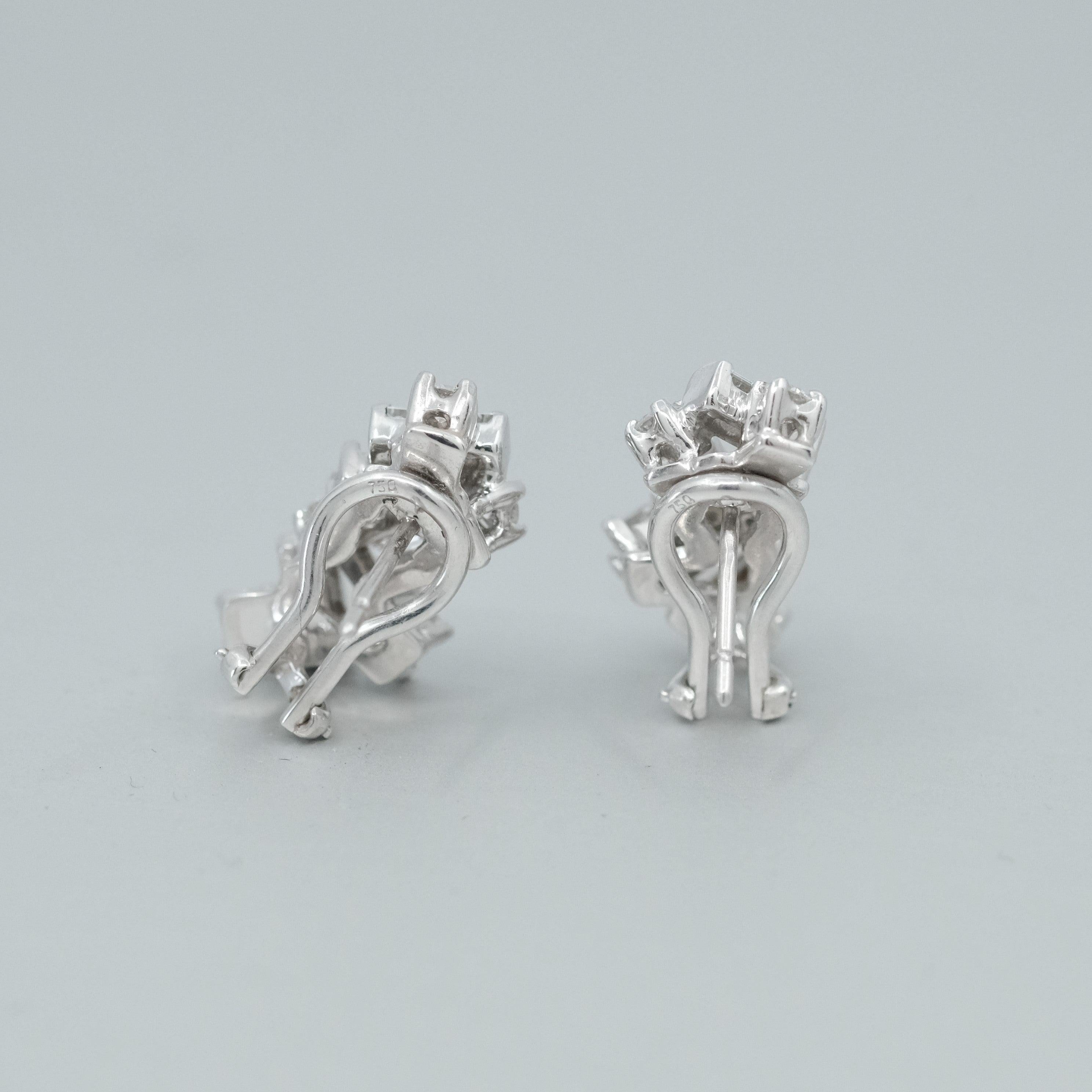 A pair of BUNDA 'Russe' Diamond earrings, in 18ct white gold, featuring a total weight of Diamonds of 1.80ct. Signed BUNDA.

Characteristics of Round Brilliant Cut Diamonds: 10 = 0.55ct, F colour, VS Clarity.

Characteristics of Asscher Cut