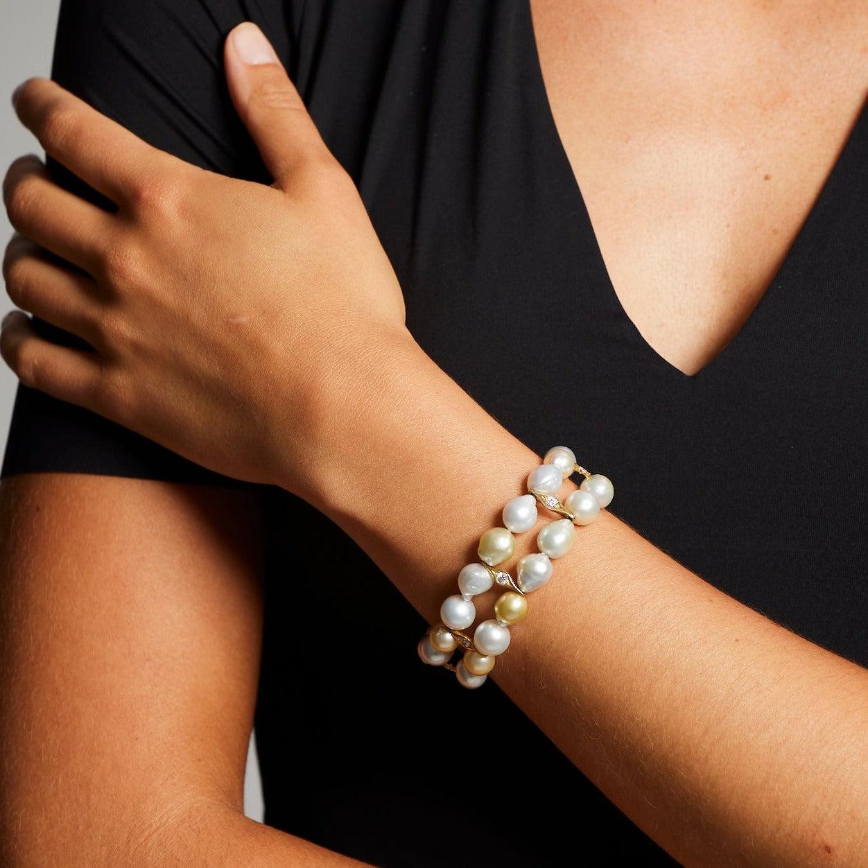 A BUNDA 'Caelum - Couture' Double Row South Sea Pearl Bracelet strung with Champagne and Silver Pearls accented with 18ct Yellow Gold and Diamond fittings. The pearls measure 9.00 to 12.00 mm and have clean skin and excellent lustre and are spaced
