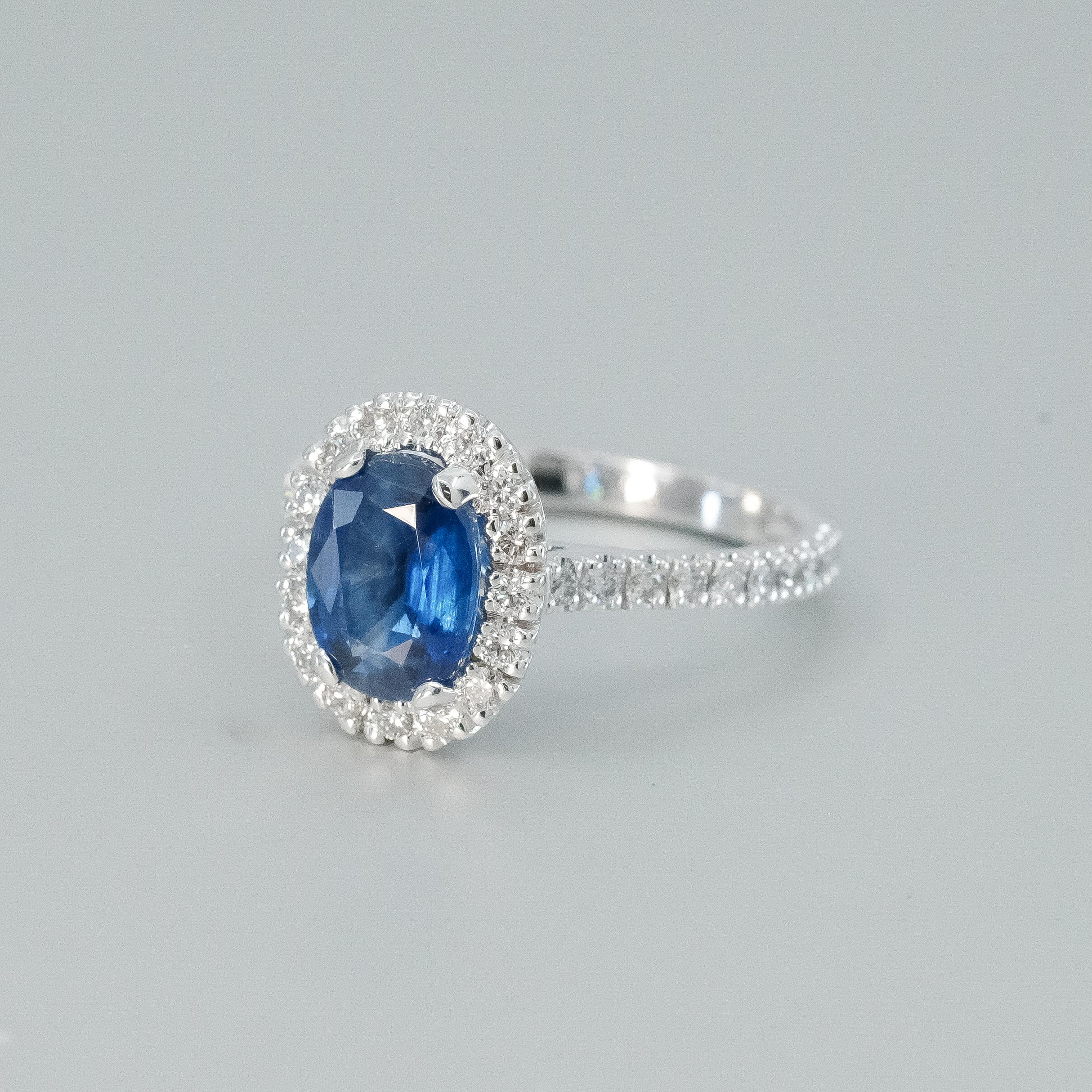 A BUNDA 'Valentin' Kyanite and diamond ring in 18 carat white gold, featuring an oval cut Kyanite, surrounded with castle set round brilliant cut diamonds to the head and shoulders.

Weight of Kyanite: 2.03ct

Characteristics of diamonds: 36 =