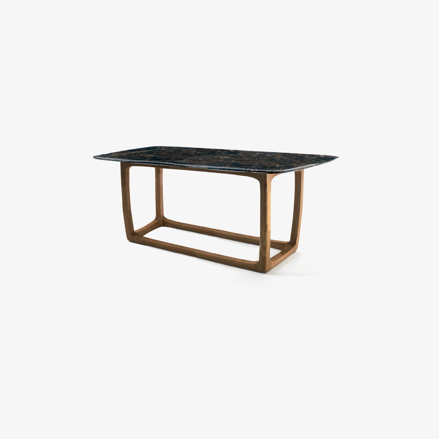 Table with structure in solid teak wood, turned, assembled and smoothed by hand, with square-shaped base combined with a marble top with rounded and protruding edges.