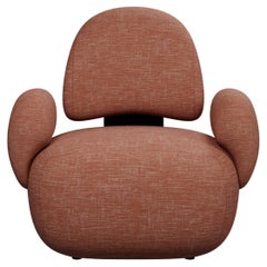 Bunny armchair in coral fabric handcrafted by Murmurio