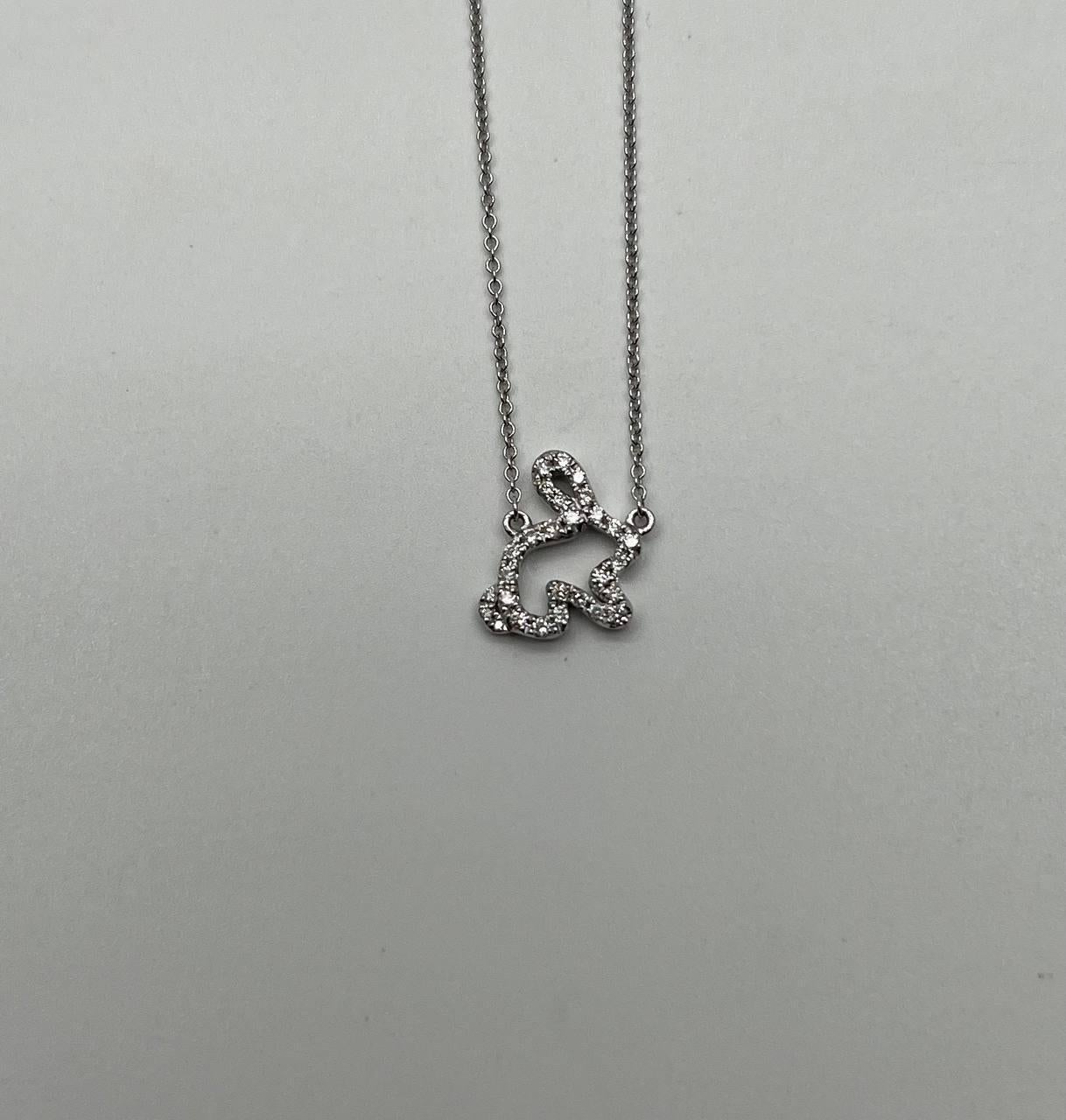 This charming necklace is crafted in 14k white gold. The pendant features a whimsical bunny shape adorned with sparkling white diamonds. The delicate chain complements the playful design, making it a delightful accessory.

Metal: 14k White