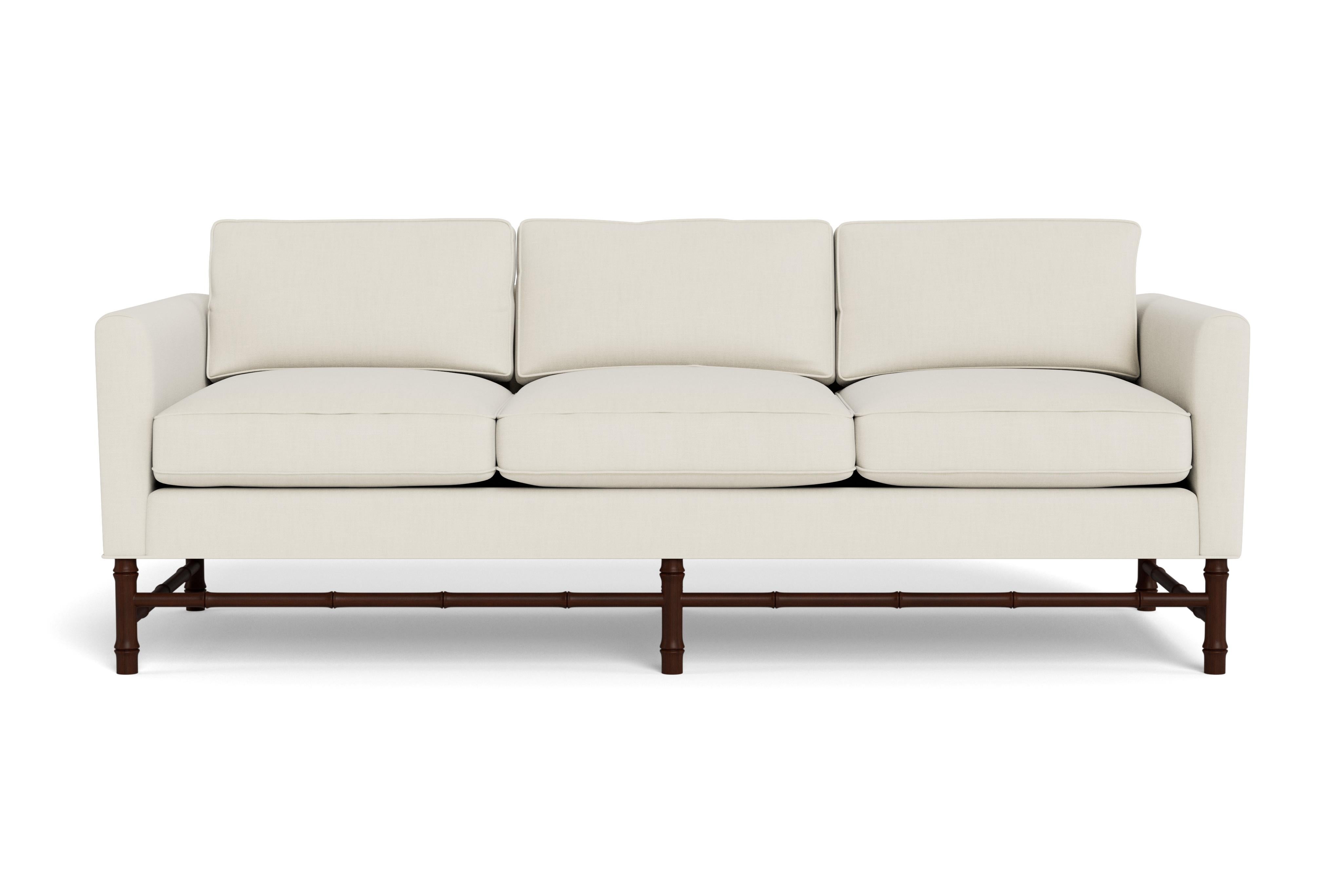 This comfortable sofa has classic, clean lines but the bamboo base gives it personality. Perfect for any style interior.  Made to order with a mahogany-stained base with our cream performance linen, a fabric able to be cleaned and used in high