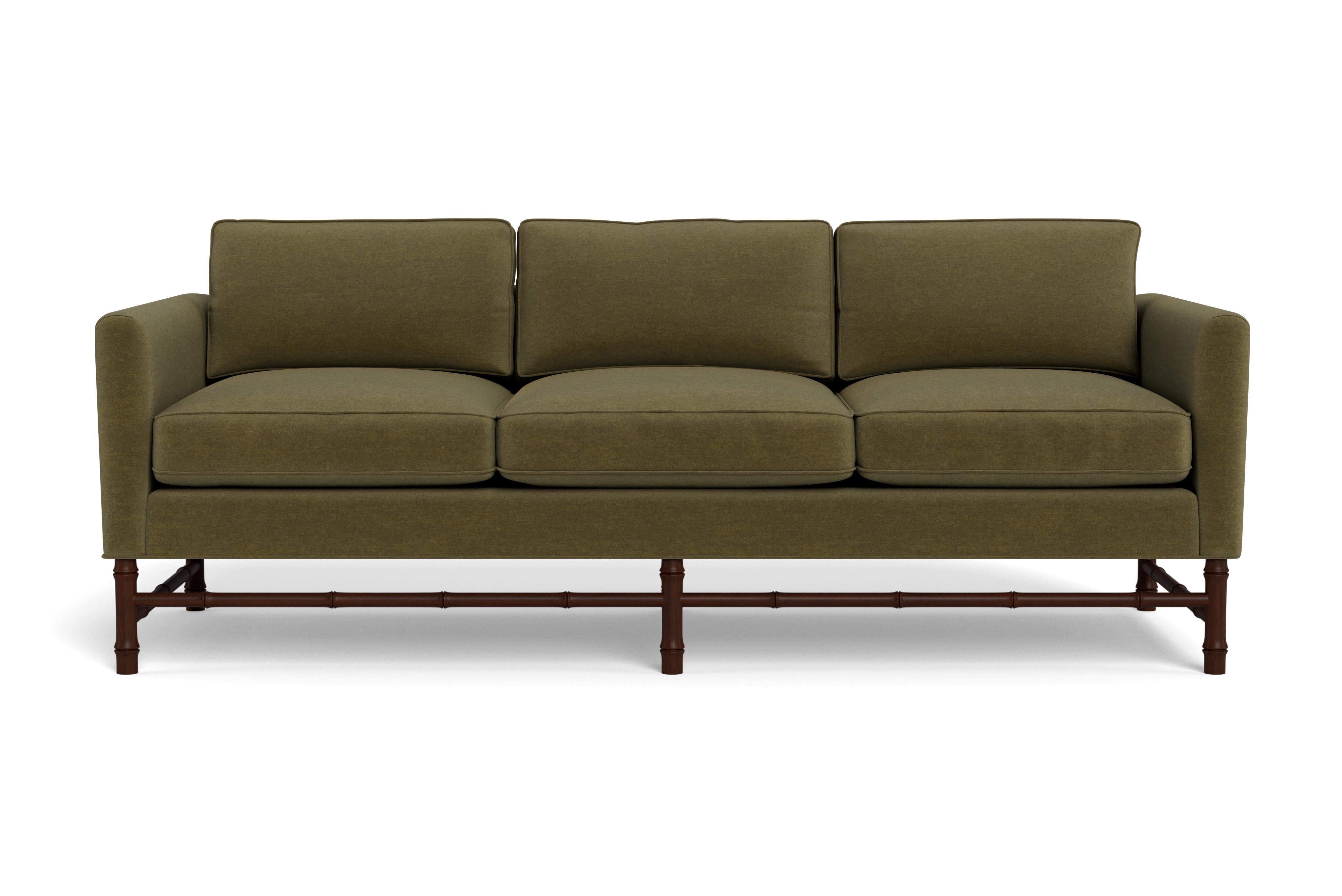 This comfortable sofa has classic, clean lines but the bamboo base gives it personality. Perfect for any style interior.  Made to order with a mahogany-stained base with our moss performance velvet, a fabric able to be cleaned and used in high
