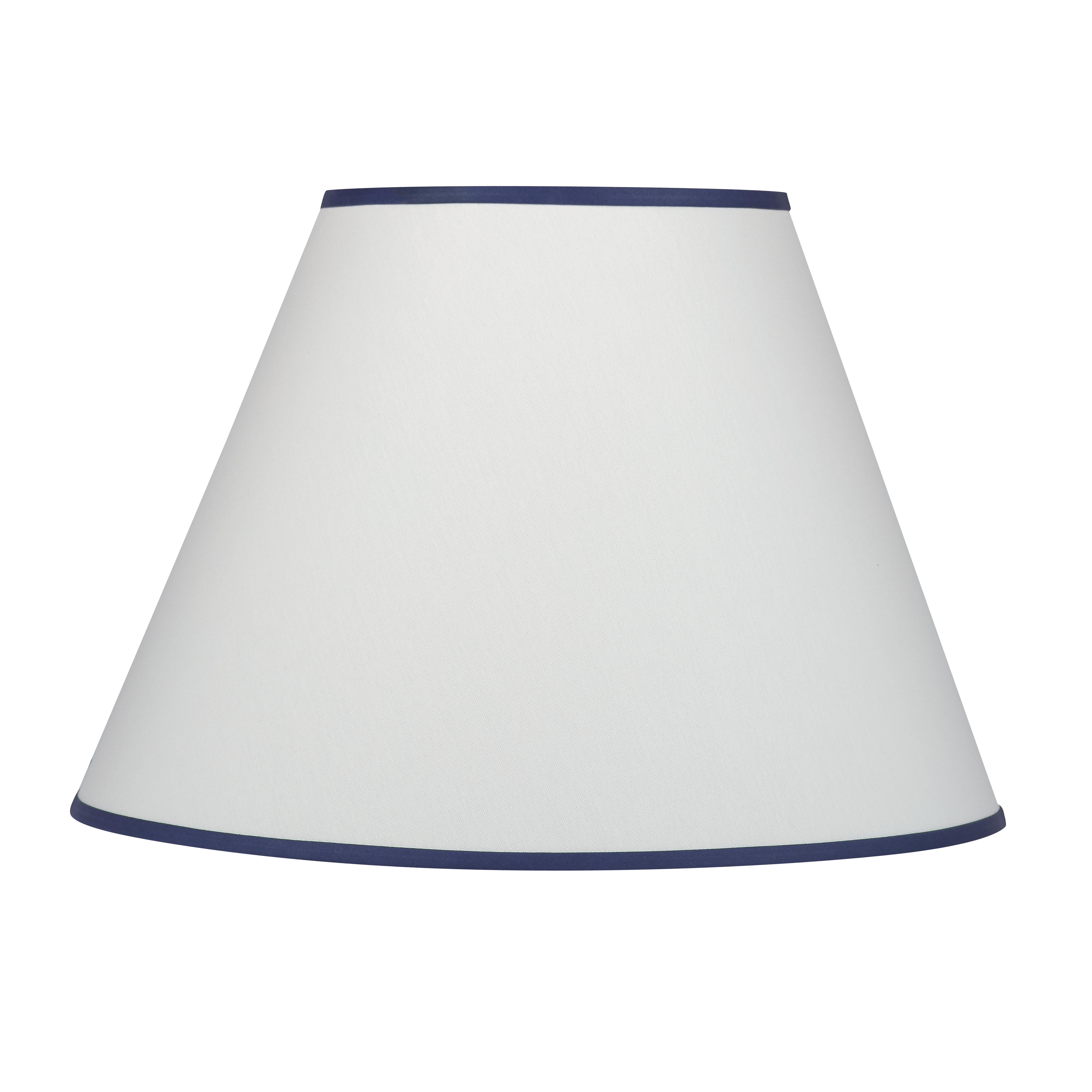 A cream colored hard-backed fabric empire shade with navy trim – an easy way to bring together similar colored elements in the room. Scaled to work on nearly all of the Bunny Williams Home table lamps.
