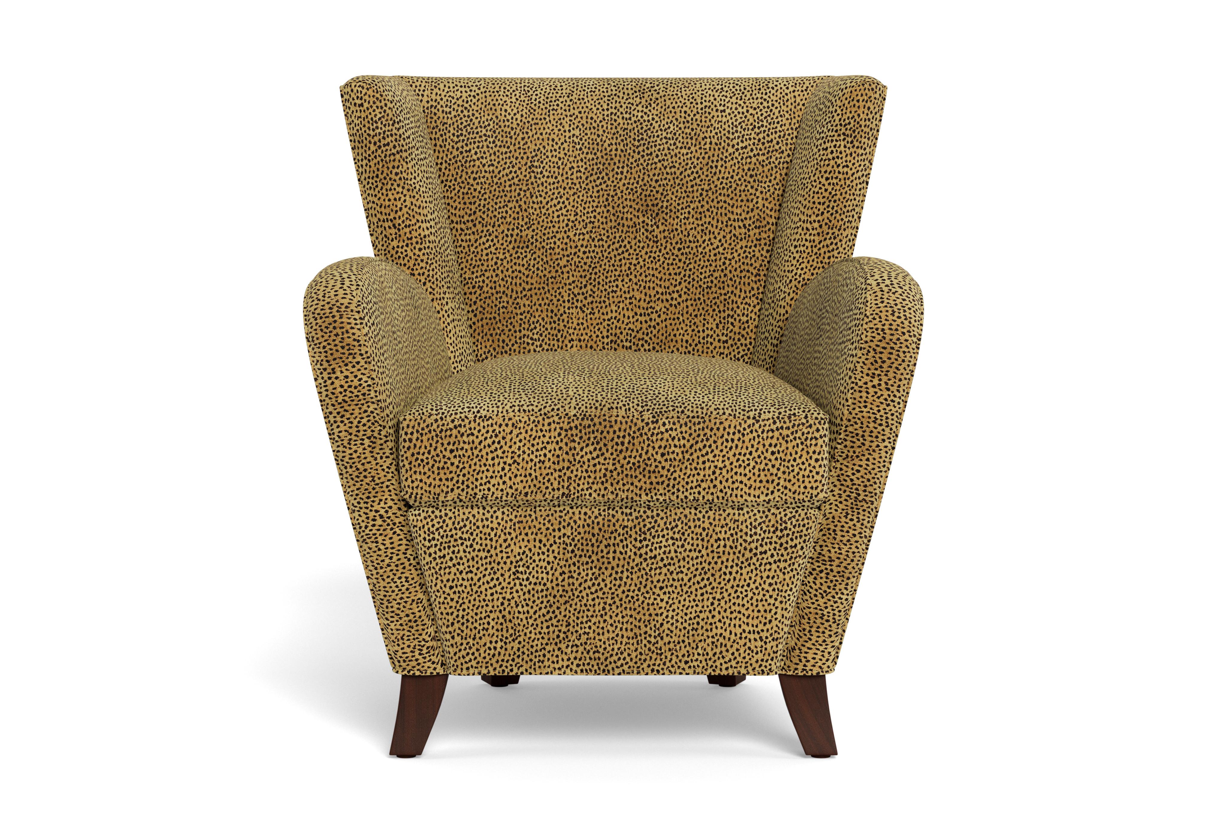 French chic updated, this sophisticated little chair cuts a curvaceous silhouette. Feminine and compact, this wing chair is thoughtfully crafted and it shows in every detail: a luxurious deep seat that totally envelops you, classic tailoring, plump