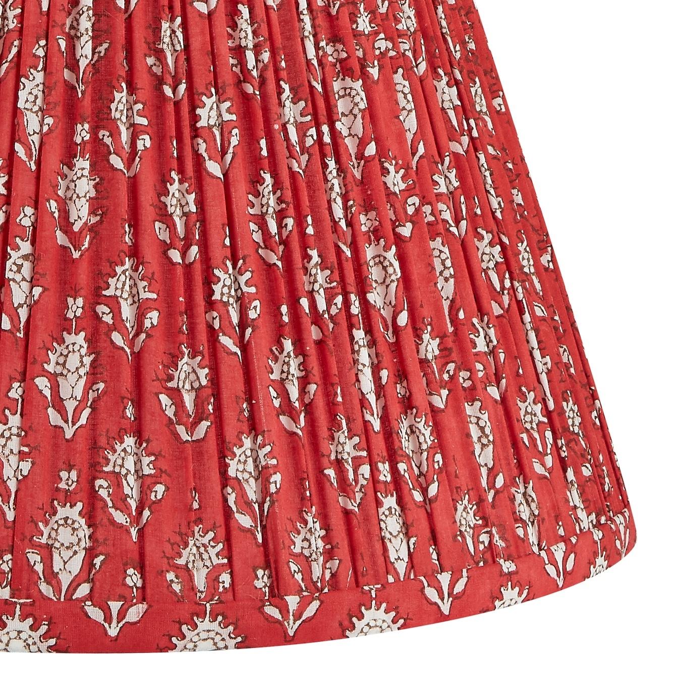 A vibrant floral pattern, the rich red looks especially beautiful atop blue lamps.

Patterned lampshades have long been a decorator’s secret to add color and texture to a space in a unique way. Our exclusive patterned shades are the perfect tool for