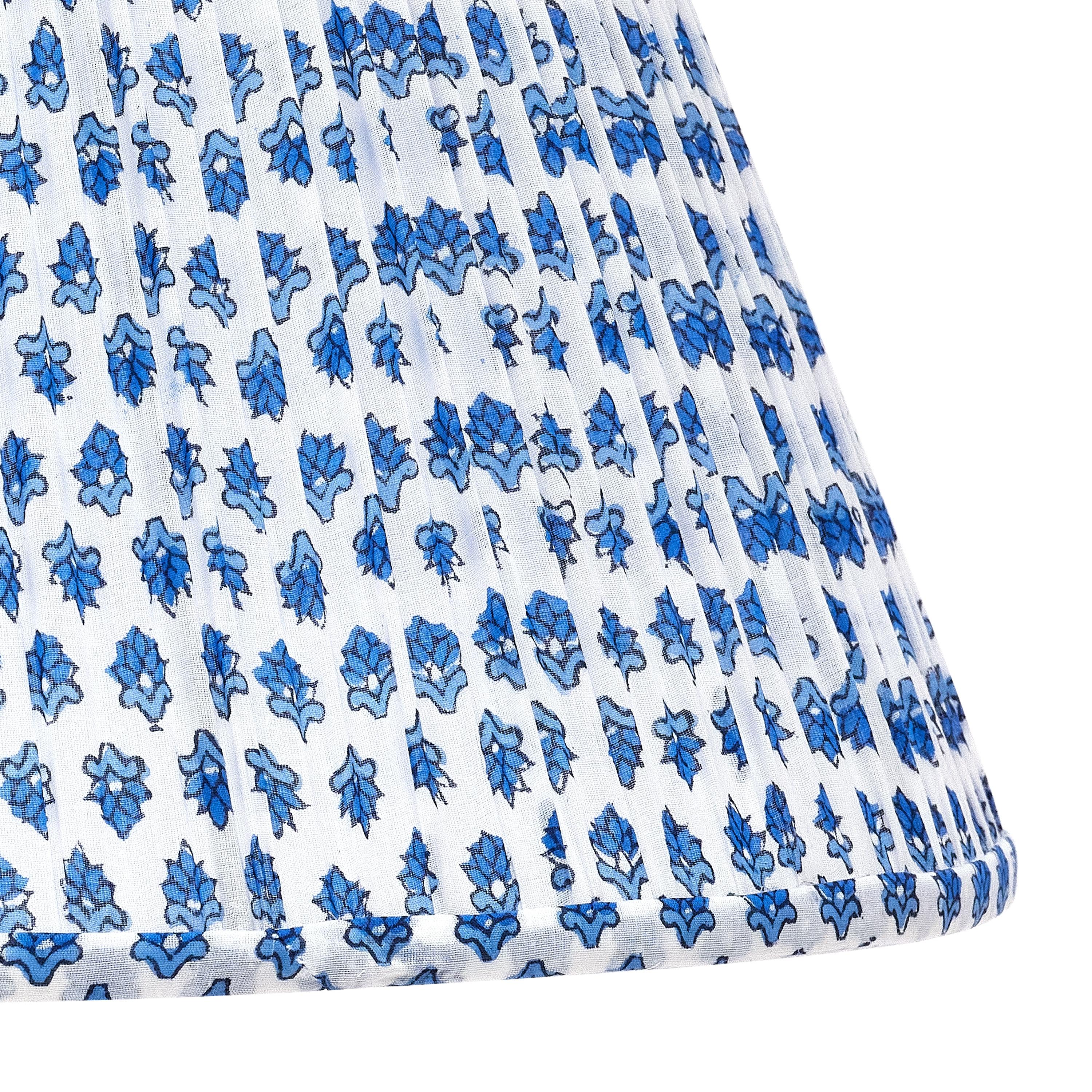 This small blue flower pattern is a beautiful, subtle neutral and would be entirely at home atop our Pheasant Feather Lamp (Brown) or Chicken Feather Lamp (Brown). Scaled to work on nearly all of the Bunny Williams Home table lamps.

Patterned