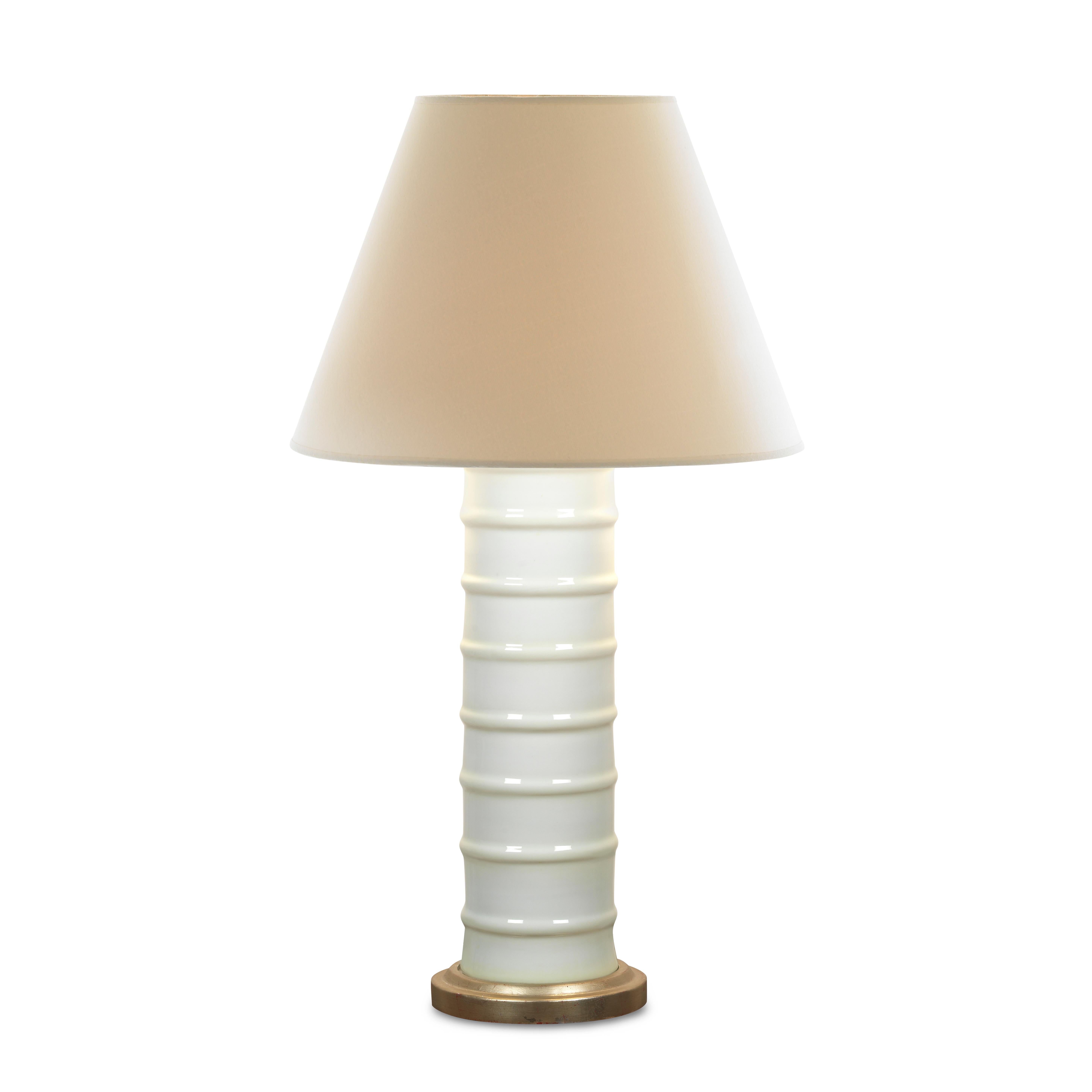One trick to successful white or neutral color schemes is to add interest through texture. Our Contoured Lamp has delicate ribbing that brings your eye from the top to the bottom of its slim cylindrical base. This truly neutral lamp would work