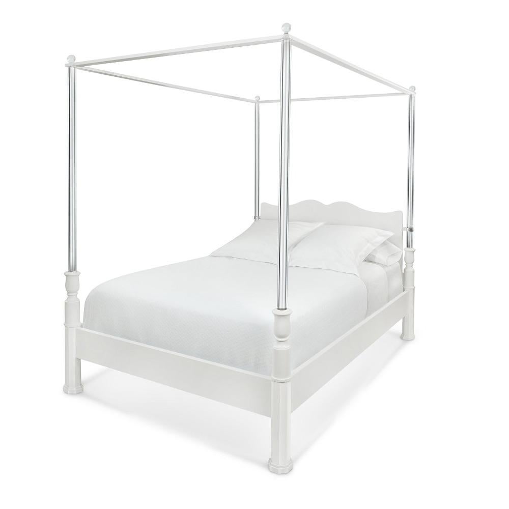 Even when pared down, the familiar form of a traditional tester bed can still be surprising. This bed refines early 20th-century interpretations that switched glass or mirror for wood. Our version favors lucite, with cylindrical lucite posts and