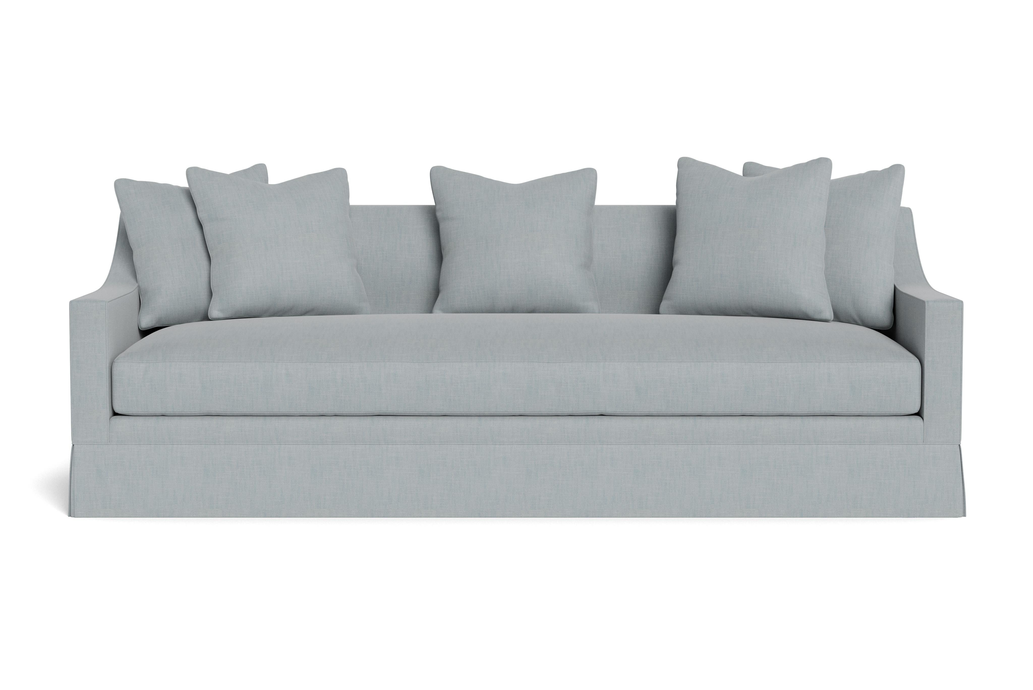 A handsome, modern skirted sofa with sloped arm. Sleek tailoring complemented by a single seat cushion and four loose pillows 21