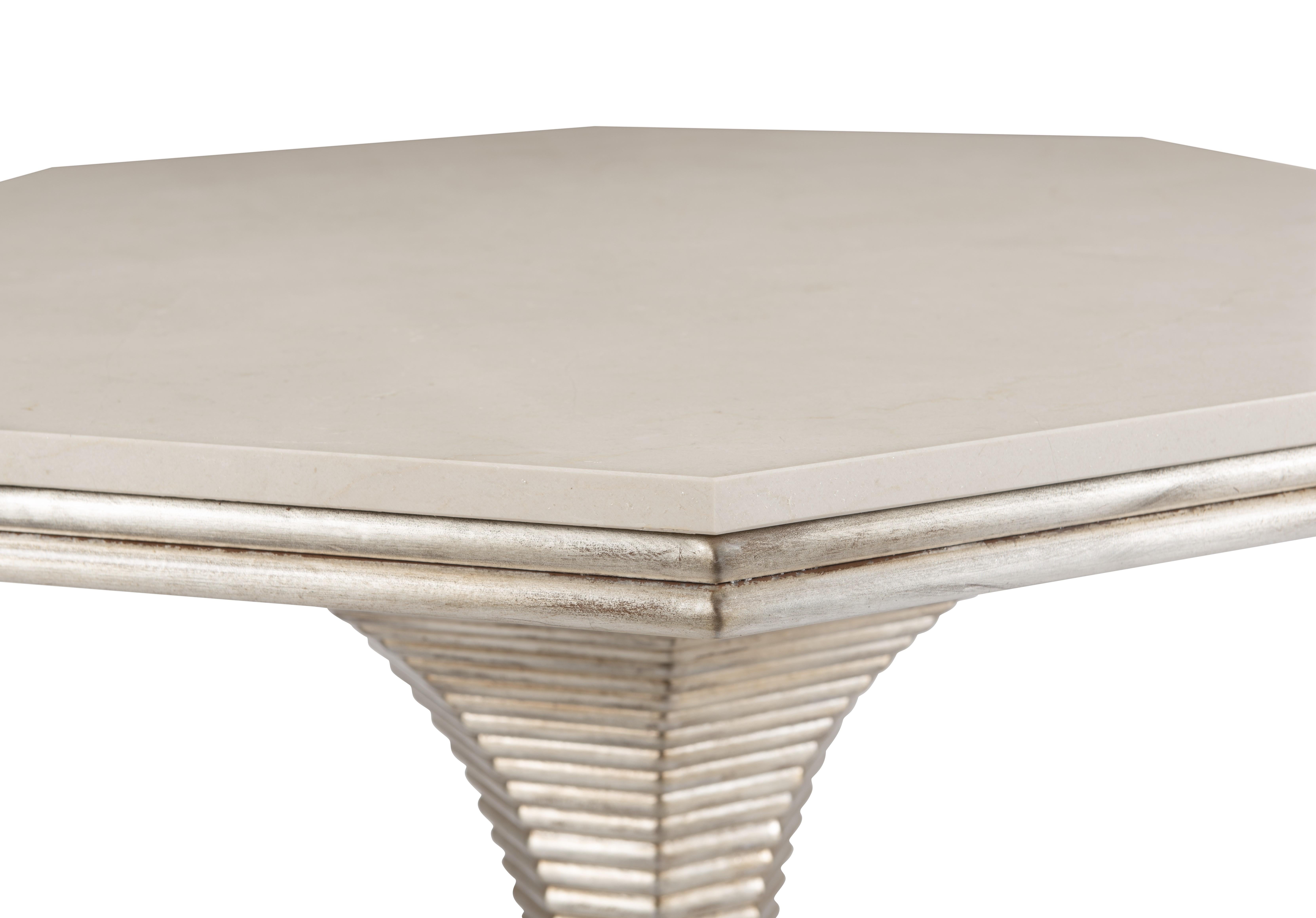 The Hourglass Table’s stone top is crafted of Crema Marfil marble, a material with unique and handsome variations. It is well-regarded for its beautiful cream color with light brown undertones as well as for its delicate veining and unique
