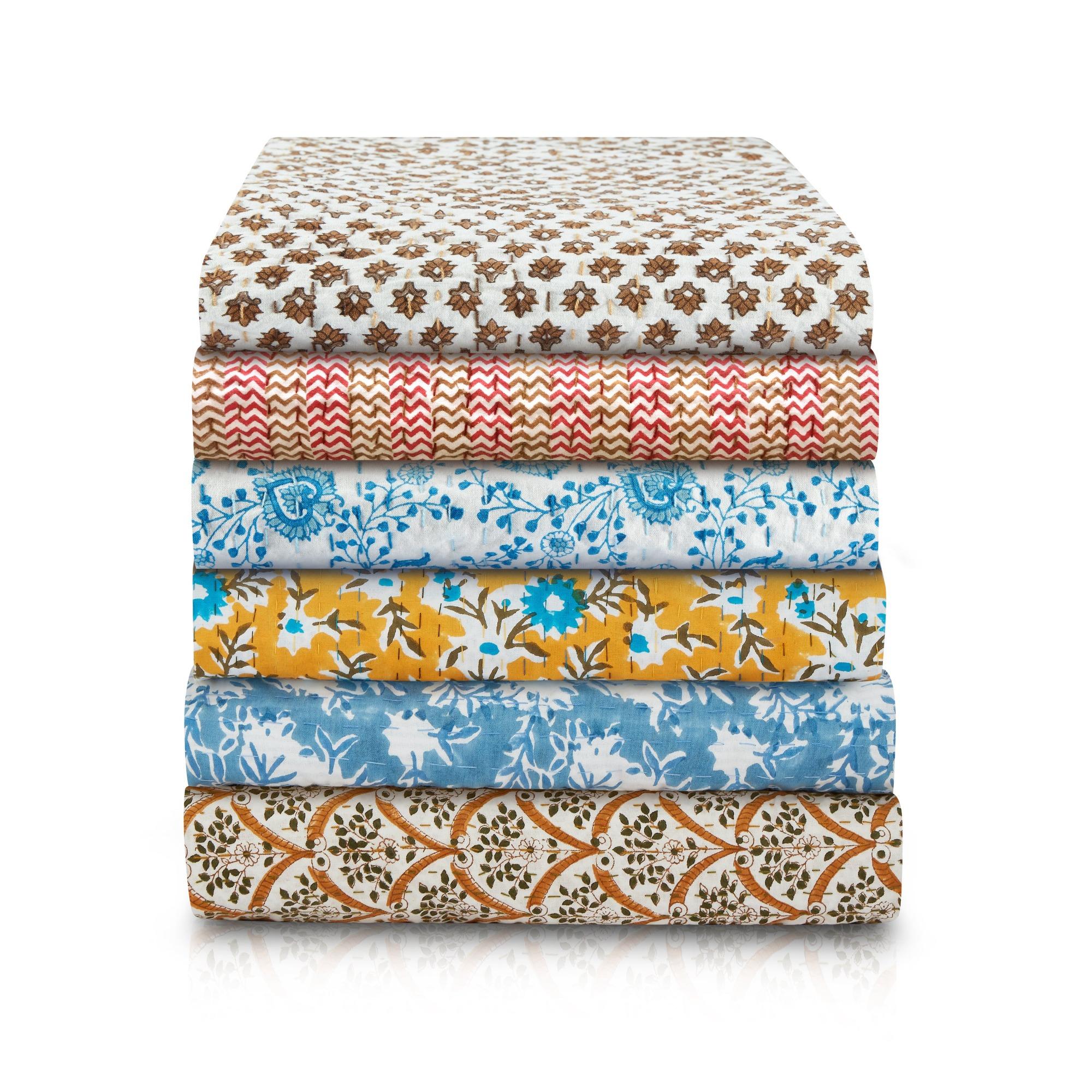 A soft, hand blocked reversible throw in blue and white, with coordinating blue stitching. Made with 100% cotton. Reversible; one side with a geometric leaf repeat, the other with an exuberant, crisp floral.

Available in three sizes:
Sofa Throw 50”