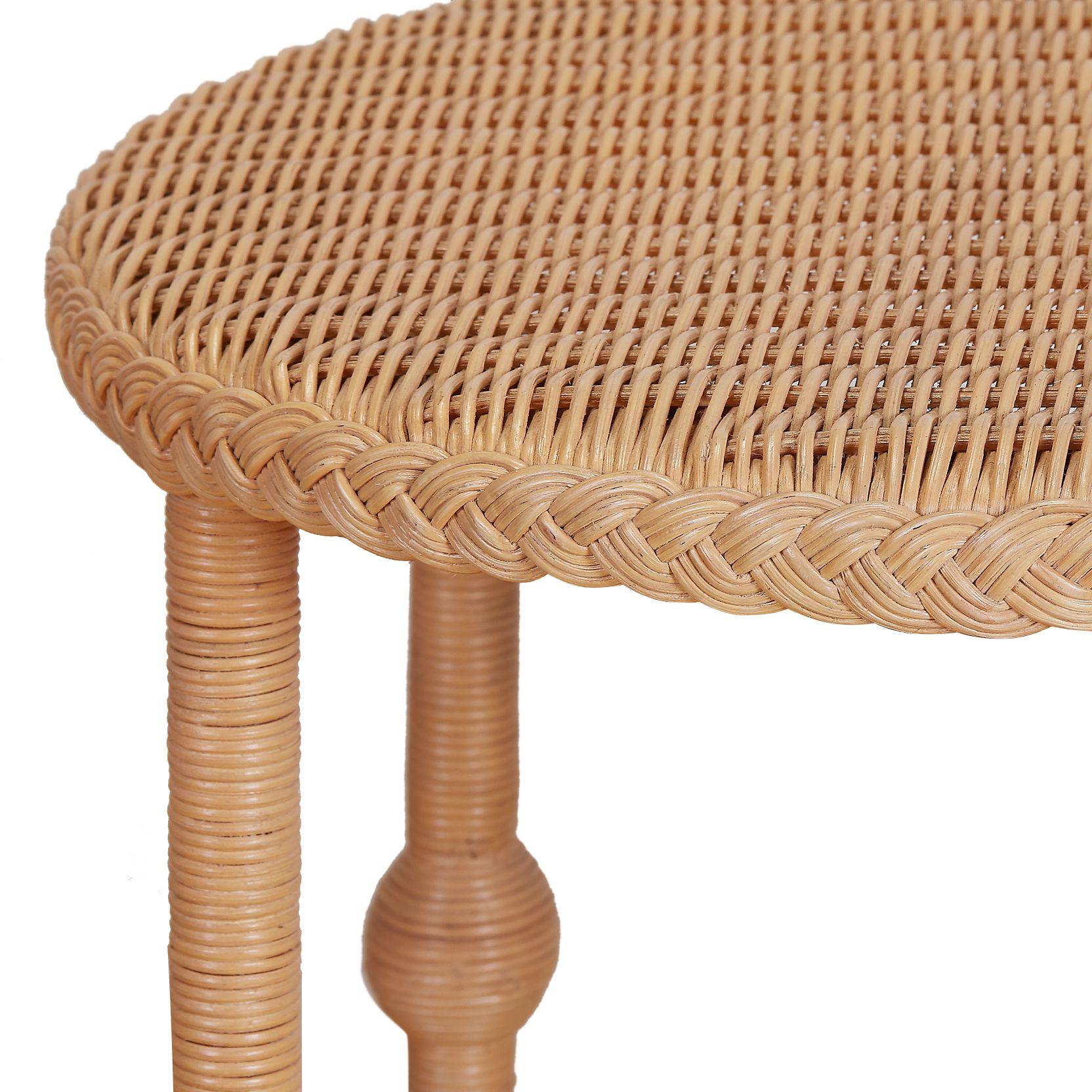 A fanciful, capacious drinks table, the Lucas has a blitheful spirit, with spherical feet echoed in the smaller spheres which bifurcate its legs. Braiding around the top and lower shelf make this a cousin of our Kenan table, and recalls the work of