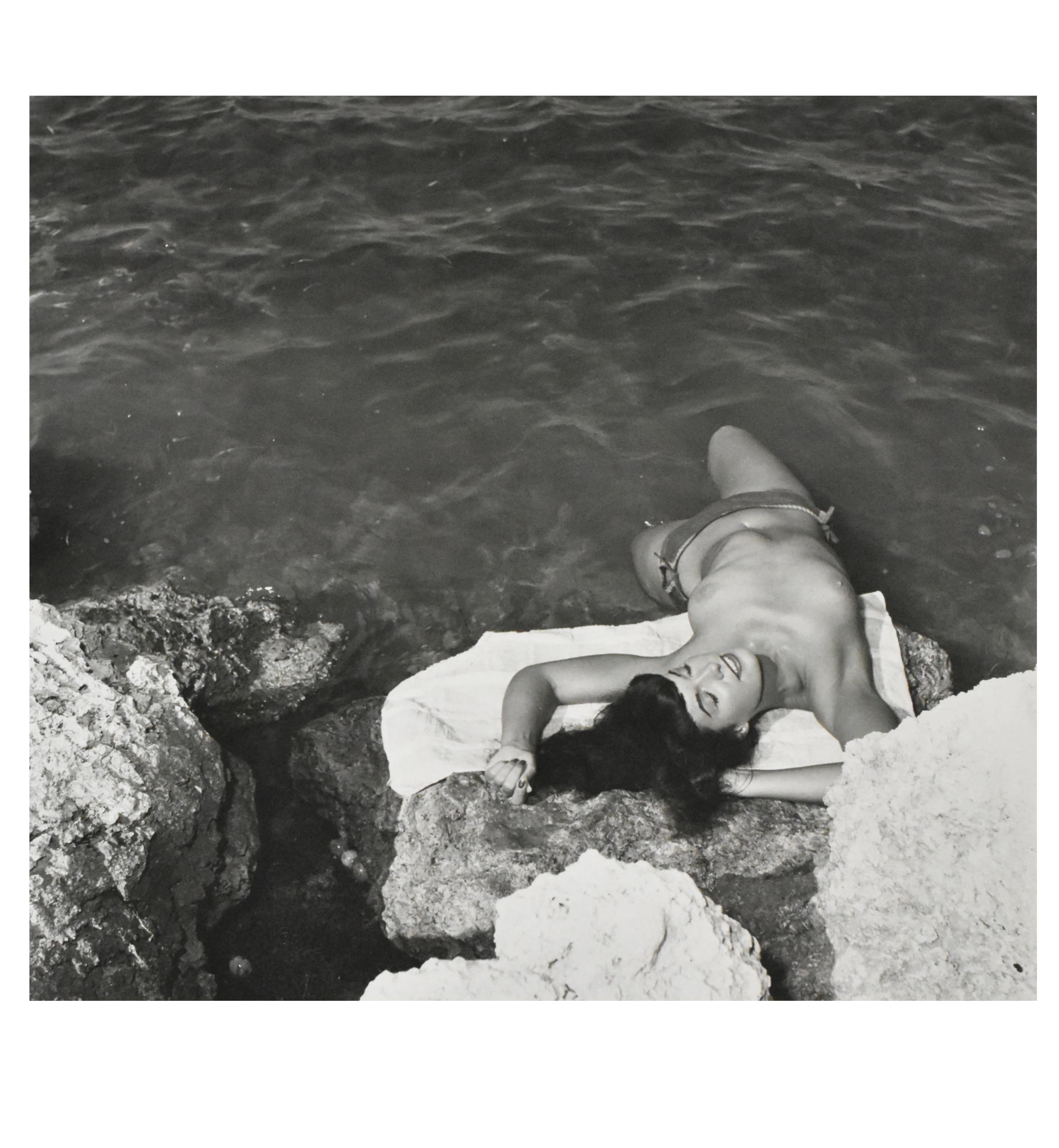 Bunny Yeager Black and White Photograph - "Bettie on The Rocks", 1954, Gelatin Silver Print