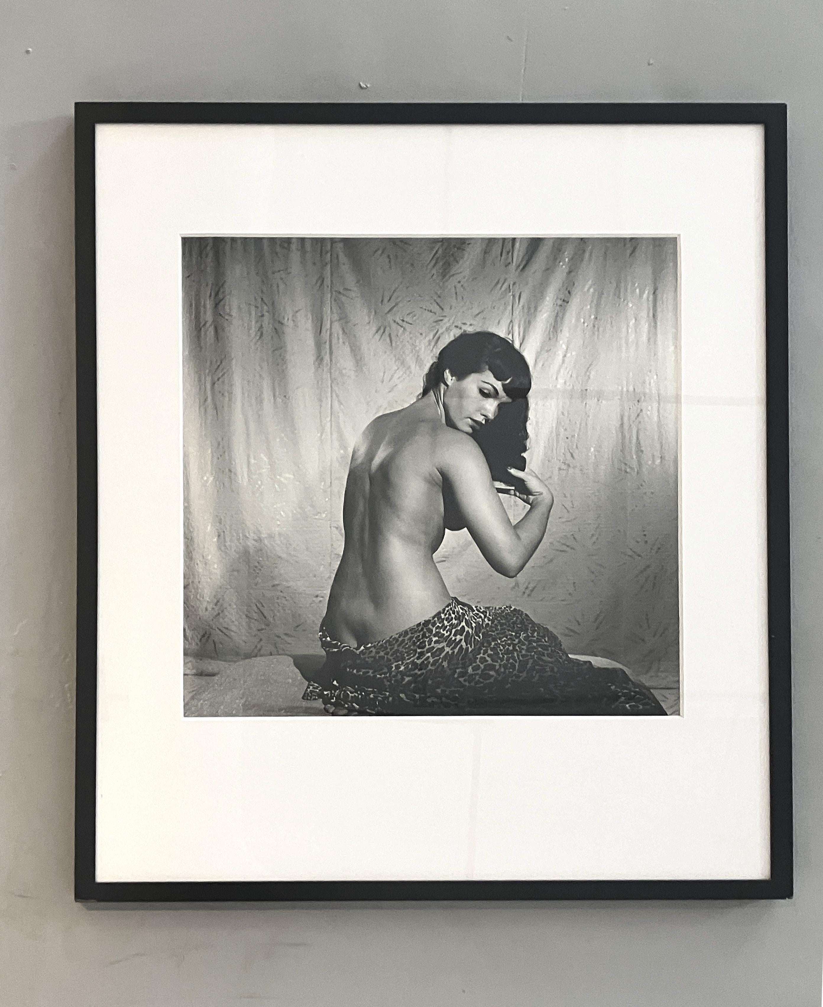 Bettie Page Clutching Robe and Bettie Page Brushing Hair. Diptych - Gray Portrait Photograph by Bunny Yeager