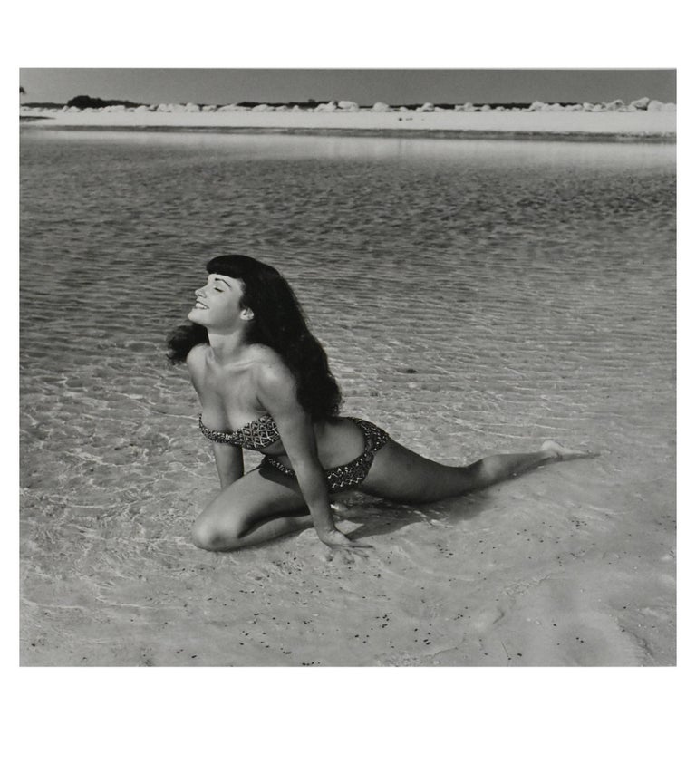 Bunny Yeager Black and White Photograph - Bettie Page 'Kneeling in Surf', Key Biscayne, FL, 1954
