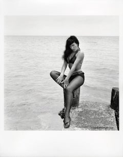 Bettie Page Seated on Pier