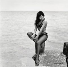 Bettie Page Seated on Pier