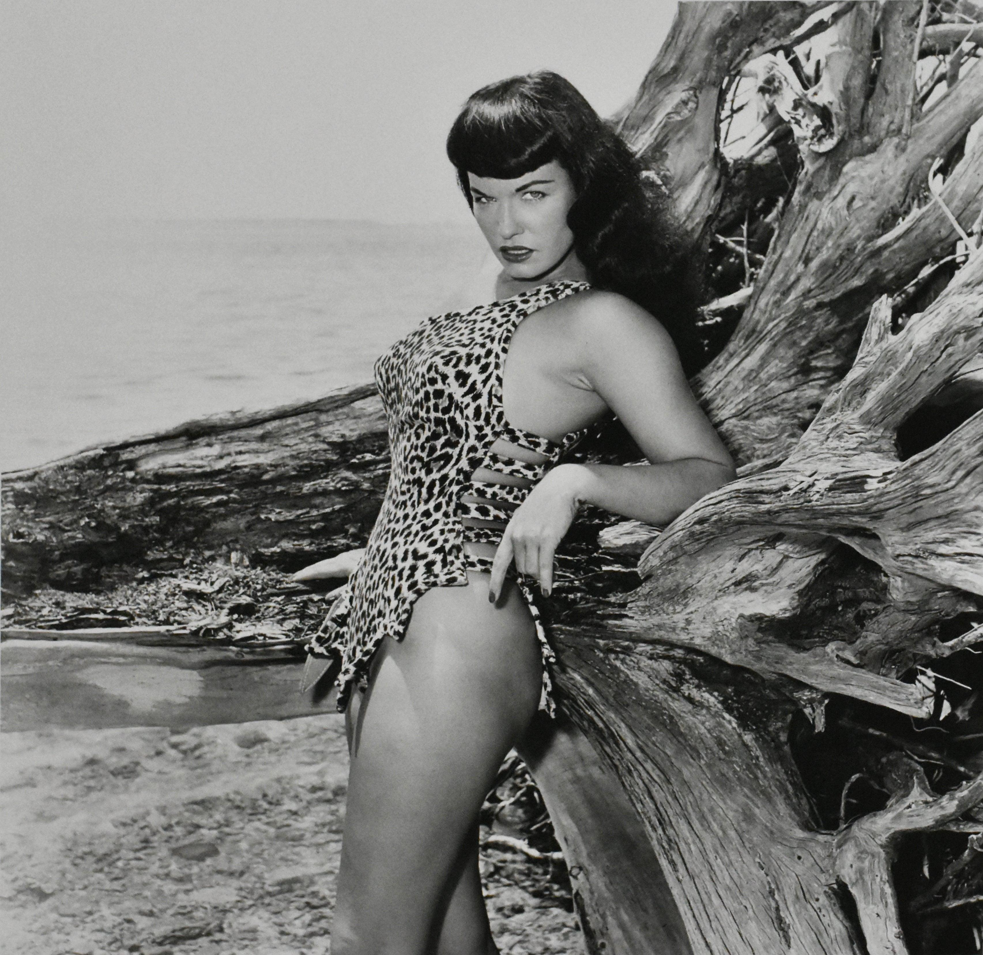 Bettie page with driftwood, key Biscayne, Florida, 1954 by Bunny Yeager
Photographed in 1954
Printed in 2012
Gelatin silver print
Sheet size: 19.75 in. H x 16 in. W
Image size: 15 in. H x 15 in. W
Edition 2 of 2
Unframed
Signed and numbered on