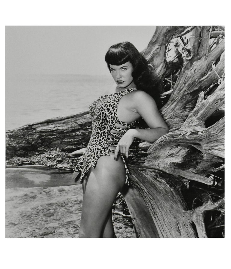 Bunny Yeager Black and White Photograph - "Bettie Page with Driftwood, Key Biscayne, FL", 1954