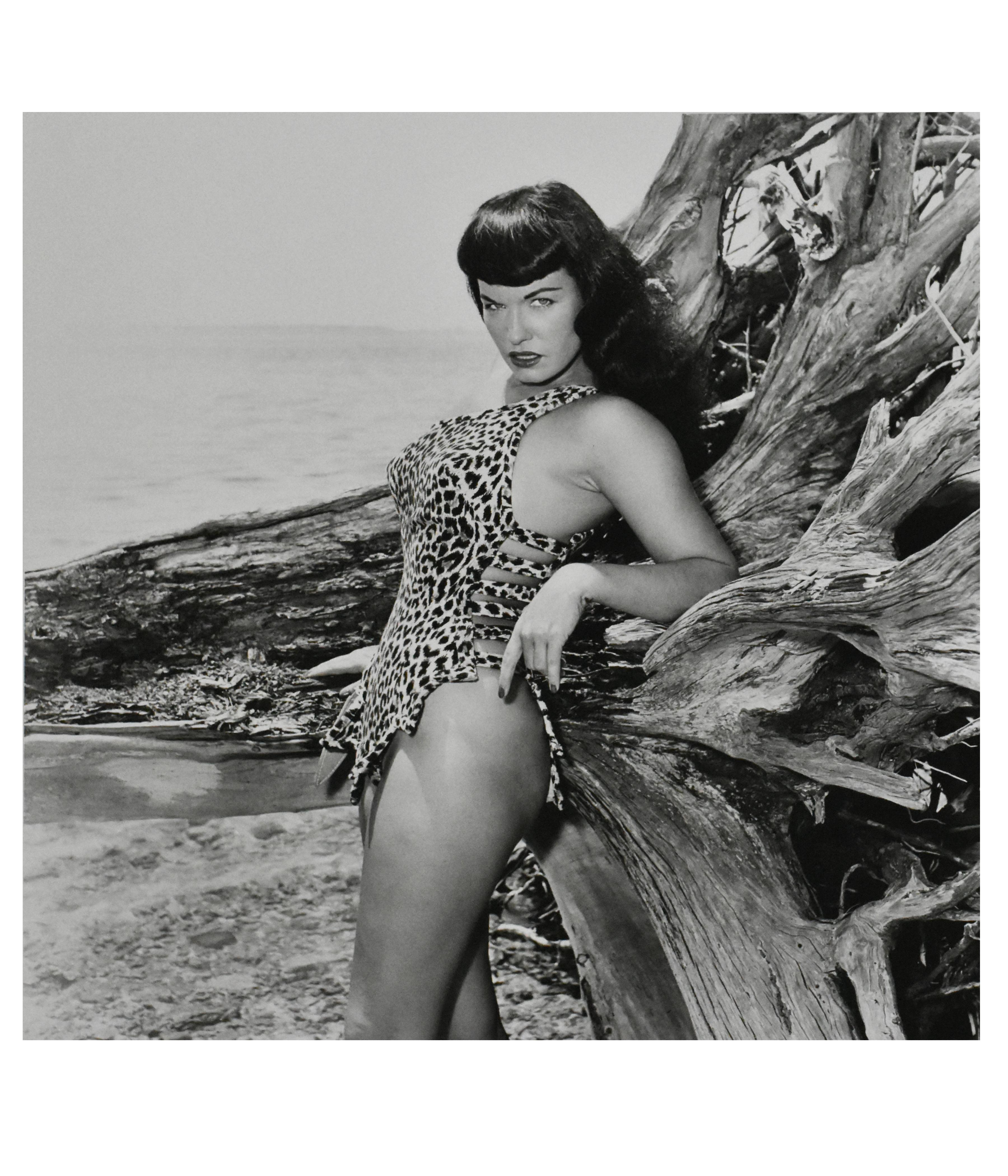 Bunny Yeager Black and White Photograph - Bettie Page with Driftwood, Key Biscayne, FL, 1954 (Framed)