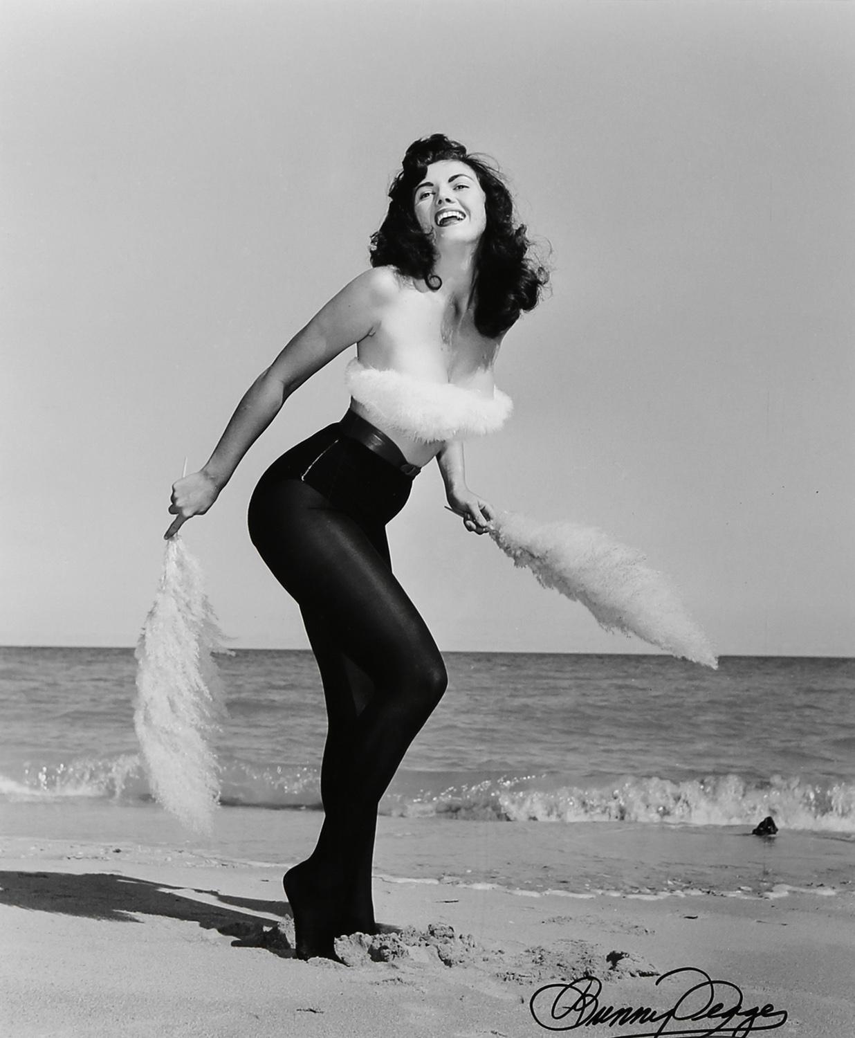Bunny Yeager Black and White Photograph - Bunny with Feathers - Miami Beach, FL