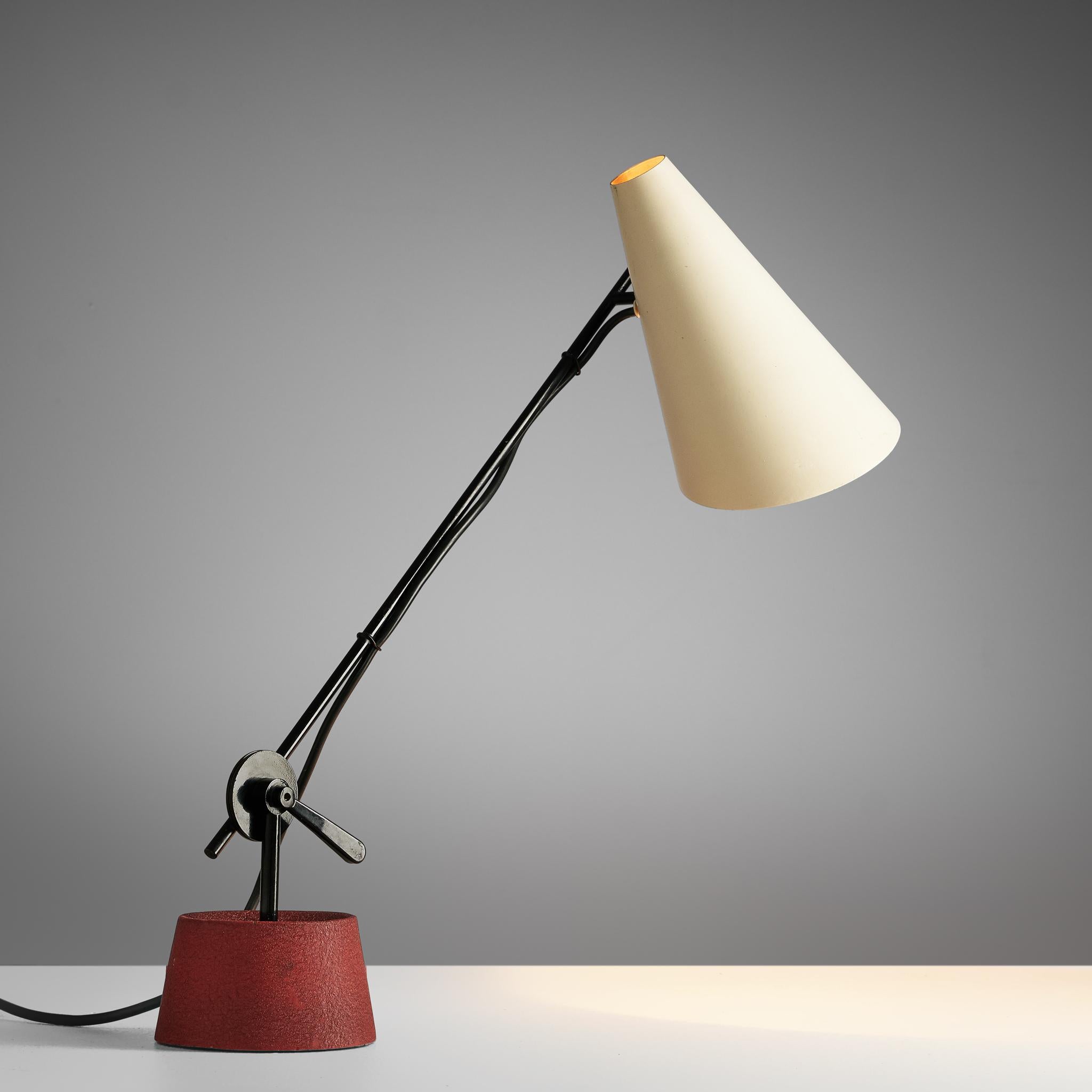 Bünte & Remmler, table light, iron, aluminum, Austria, 1950s.

Made by Bünte & Remmler, this desk lamp features a red, circular iron base, upon which a black iron stem is mounted, adjustable in angle. The cone-shaped shade in off-white is affixed to