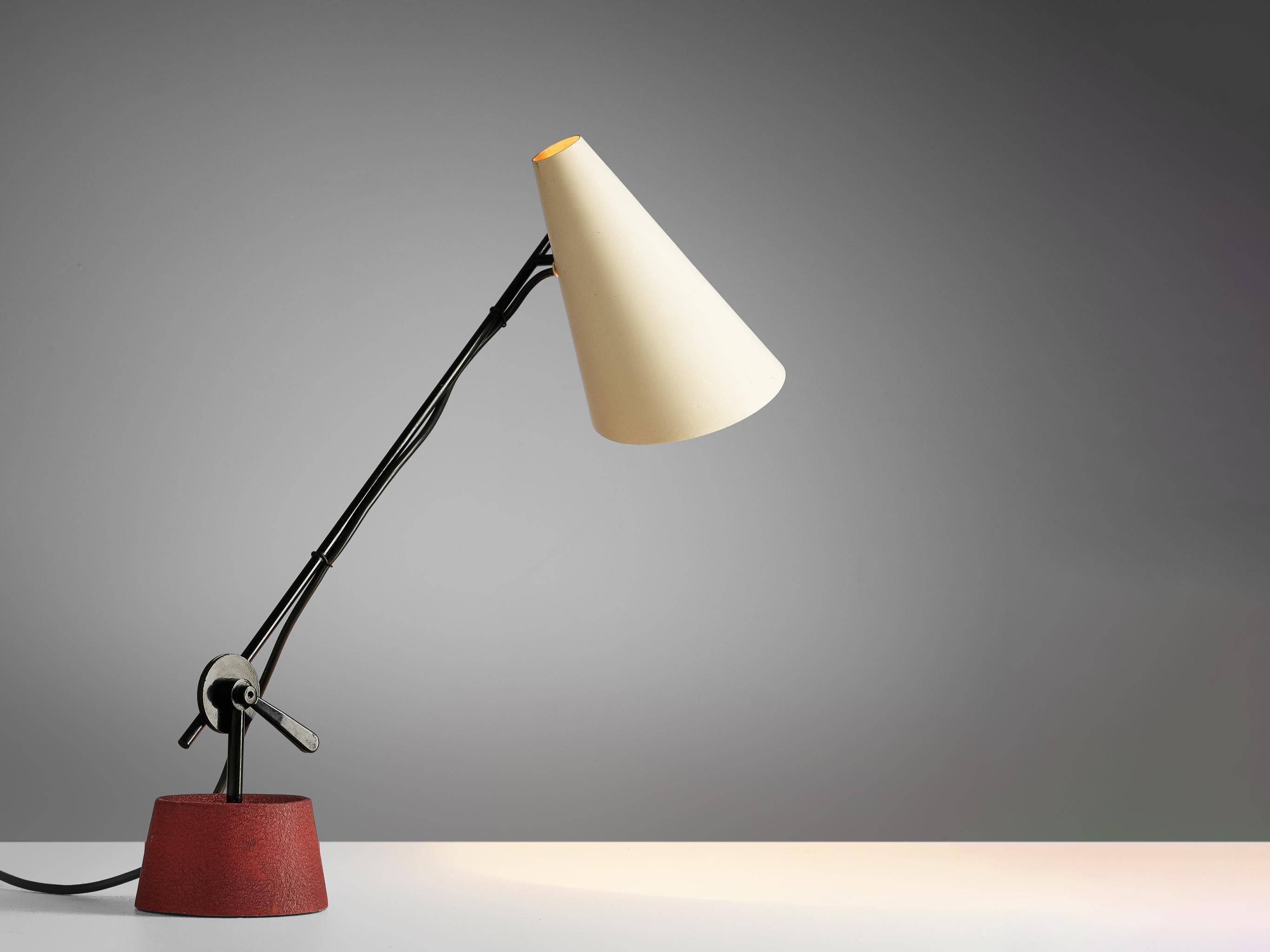 Bünte & Remmler, table light, iron, aluminum, Austria, 1950s.

Made by Bünte & Remmler, this desk lamp features a red, circular iron base, upon which a black iron stem is mounted, adjustable in angle. The cone-shaped shade in off-white is affixed to