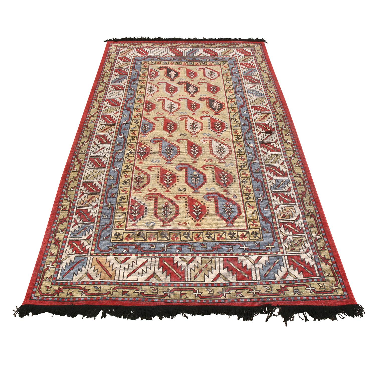 Originating from India, this hand knotted wool rug belongs to Rug & Kilim’s premier Burano collection, celebrating inspirations in its field design from the boteh pattern, a widely believed symbol of beauty, creation, and many themes varying from