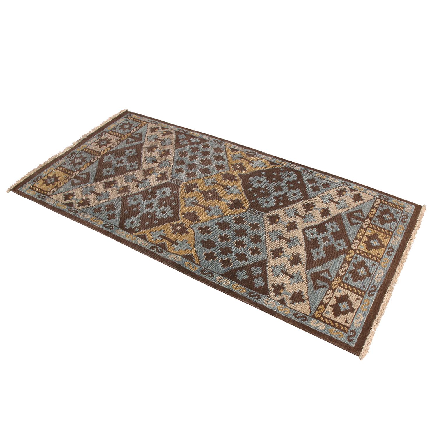 Originating from India, this hand knotted contemporary wool rug hails from Rug & Kilim’s premier Burano collection, enjoying a unique marriage of tribal patterns with more forgiving, versatile hues of brown, beige, blue, and golden-yellow