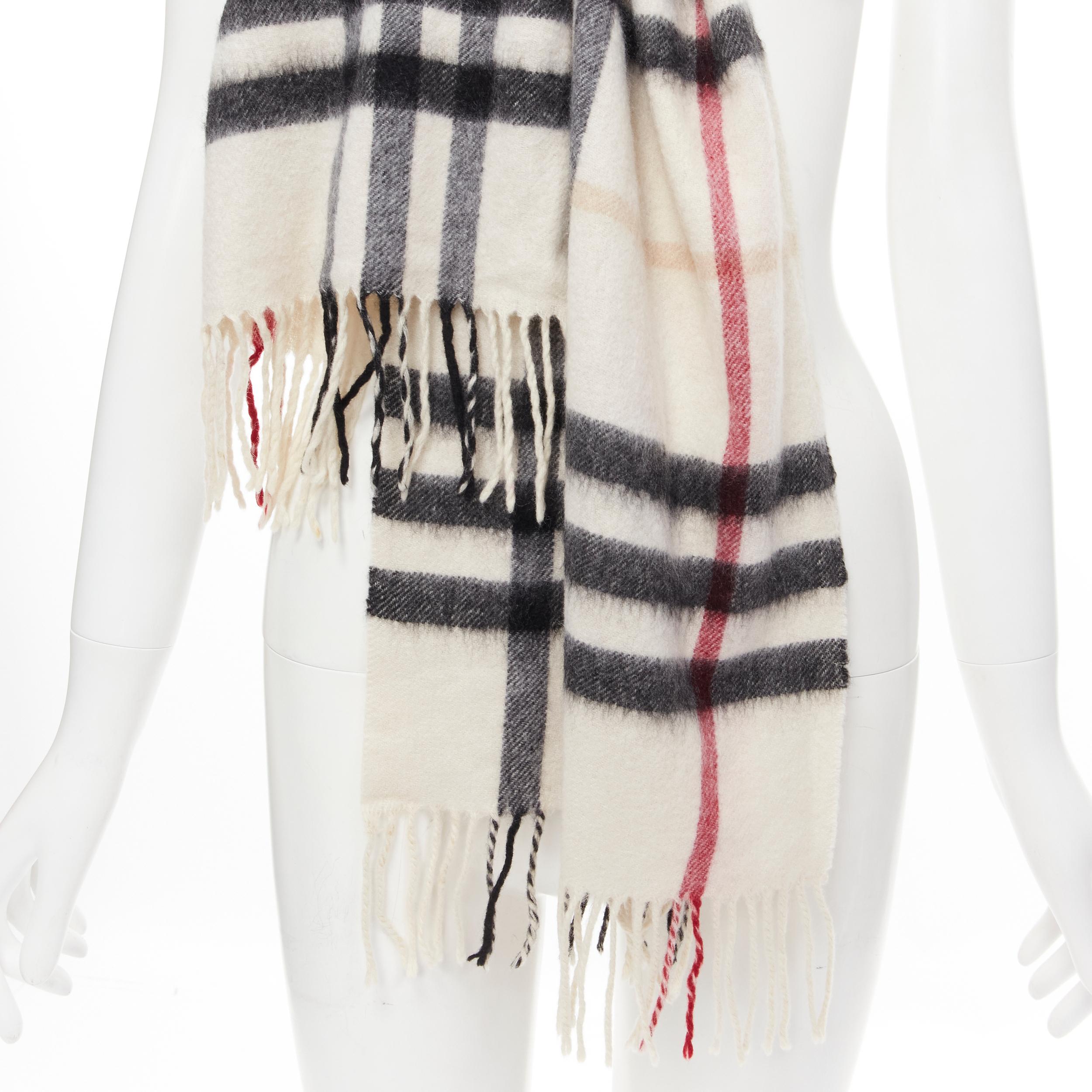 BURBERRY 100% cashmere Classic House Check fringe scarf stone 
Reference: DNCU/A00002
Brand: Burberry 
Material: Cashmere 
Color: Beige 
Pattern: Check 
Made in: Scotland 

CONDITION: 
Condition: Good, this item was pre-owned and is in good