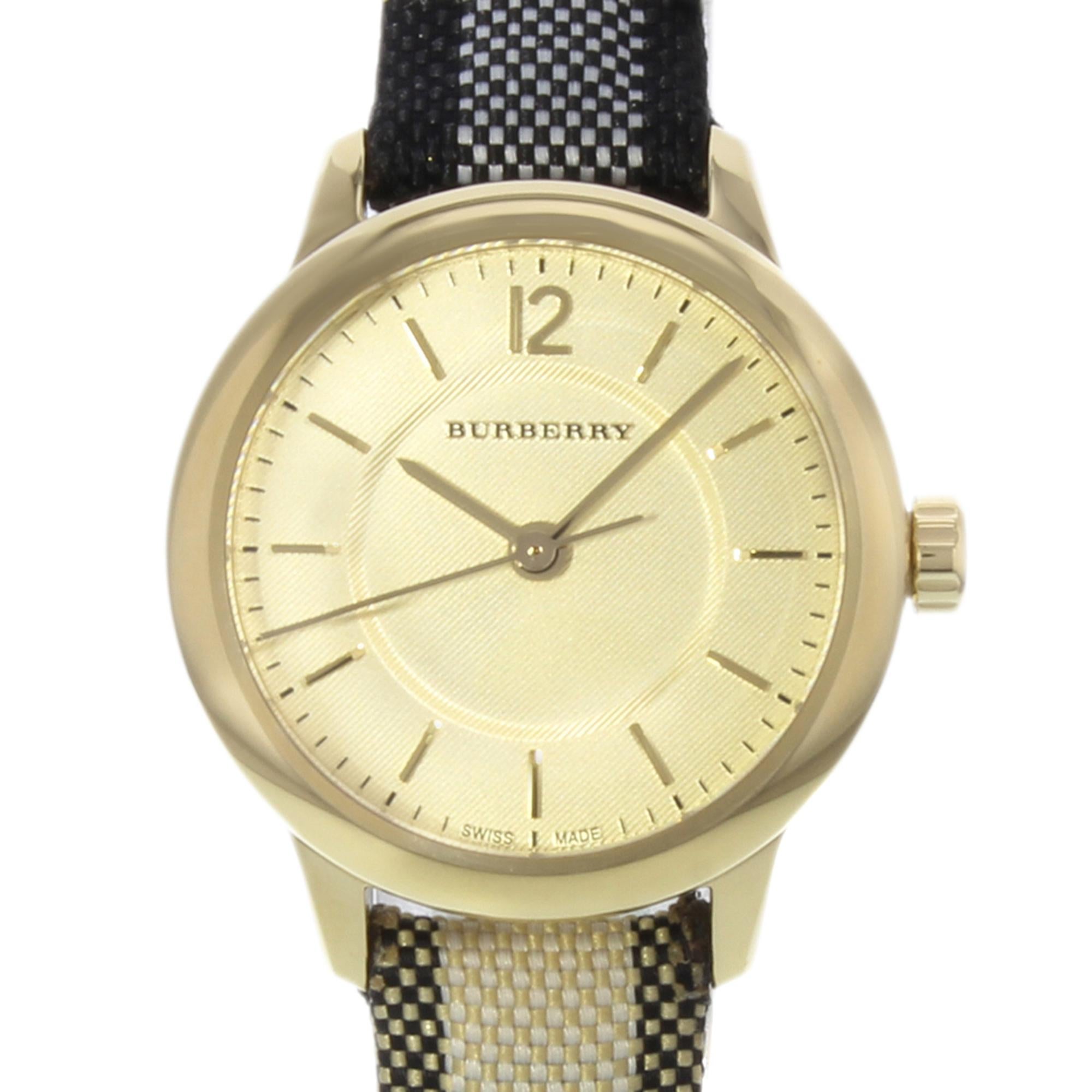 This display model Burberry BU10201 is a beautiful Ladies timepiece that is powered by a quartz movement which is cased in a stainless steel case. It has a round shape face, no features dial and has hand sticks style markers. It is completed with a