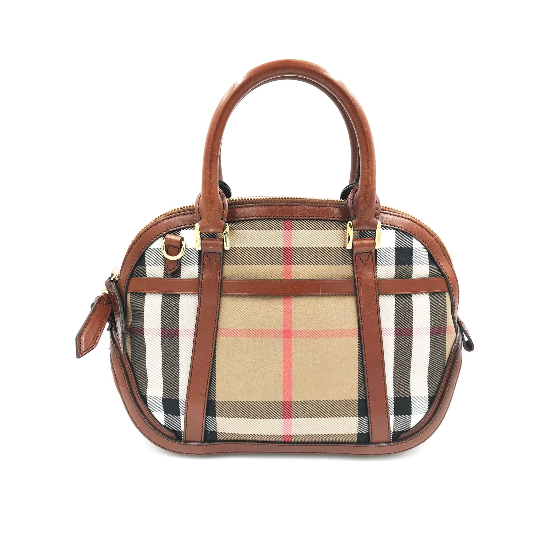 Brown leather and cotton cotton 'Orchard' tote from Burberry featuring a nude and black Haymarket check body. a gold-tone zip up fastening, two short rounded handles to the top, a detachable shoulder strap, a padlock charm detail to the front and a