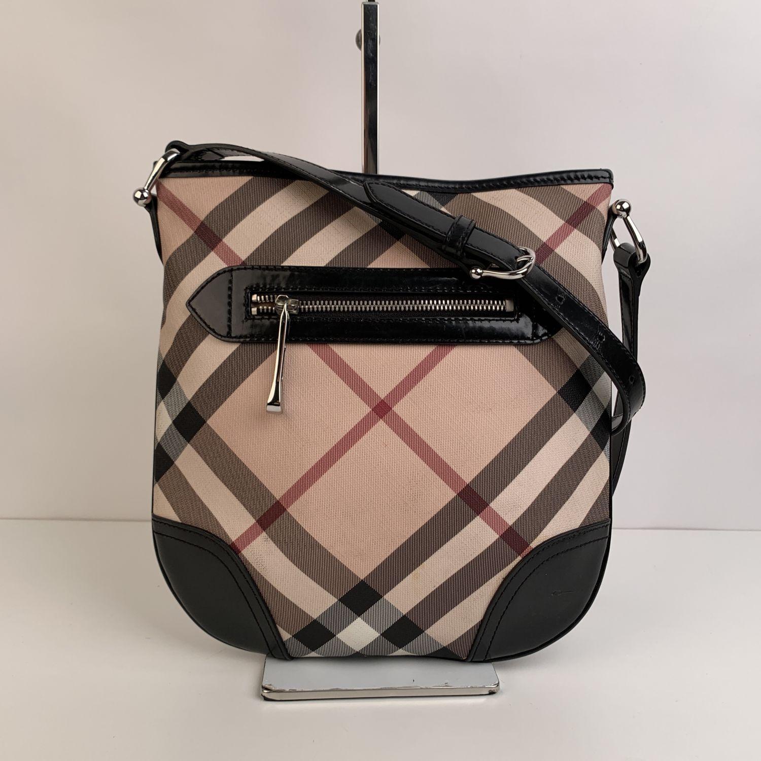 This beautiful Bag will come with a Certificate of Authenticity provided by Entrupy, leading International Fashion Authenticators. The certificate will be provided at no further cost.

- Burberry Nova Check Canvas Messenger Bag
- Featuring