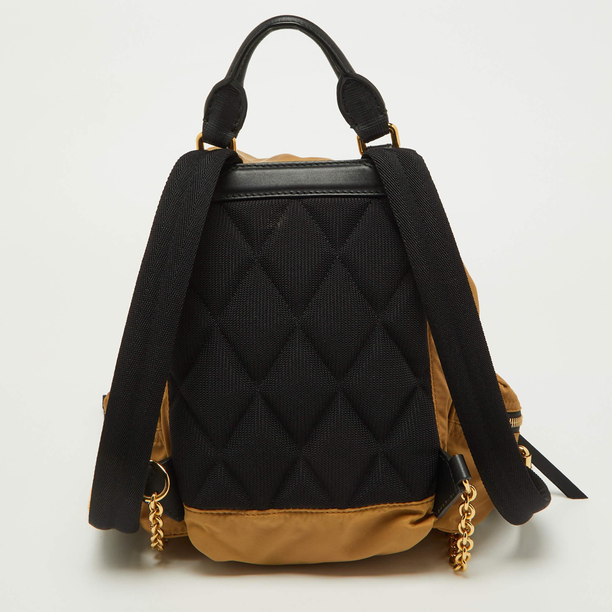 Marked by flawless craftsmanship and enduring appeal, this Burberry backpack is bound to be a versatile and durable accessory. It has a practical size.

