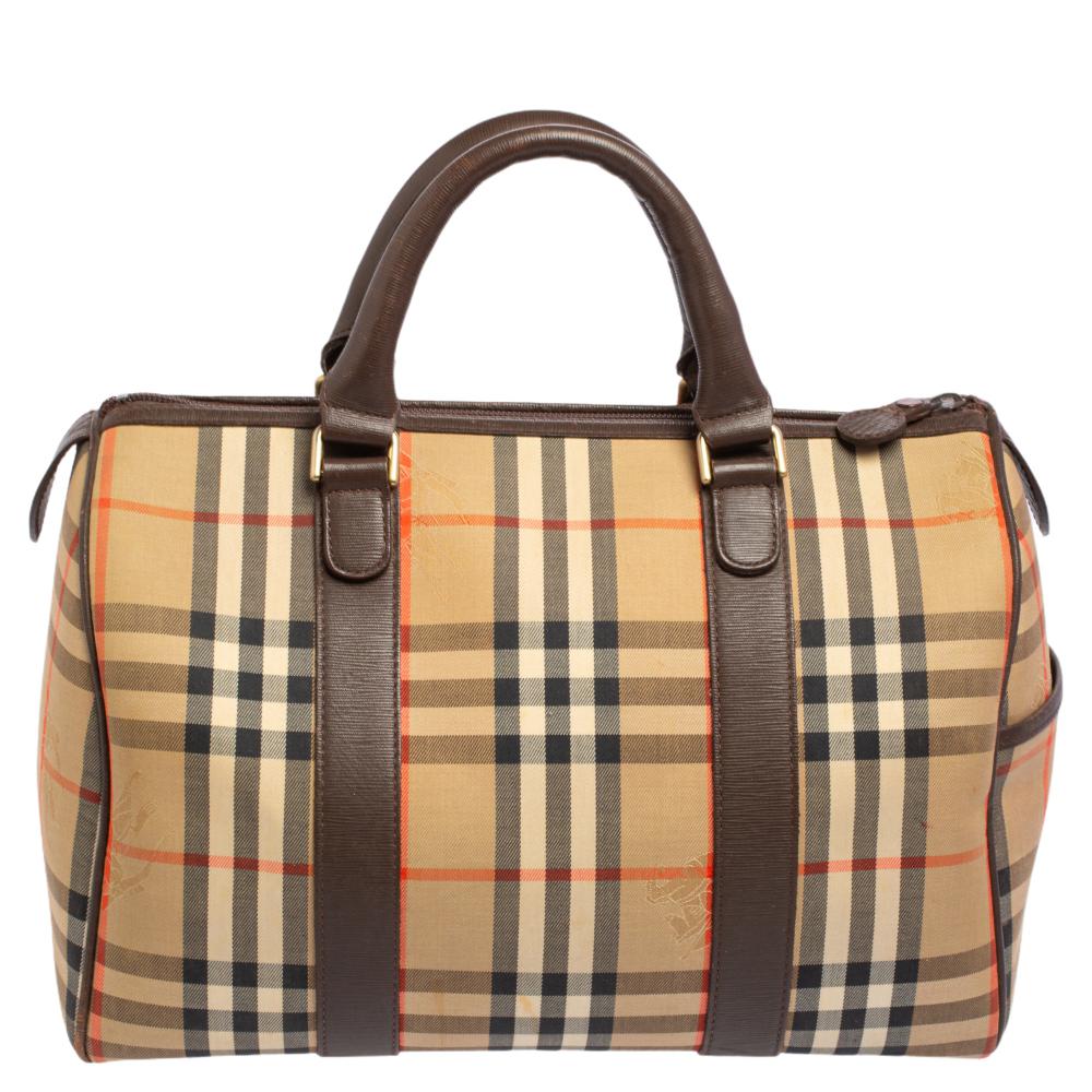 Crafted with Haymarket check canvas and leather, you will find this bag an ideal companion for all your needs. The inside is lined to perfection and sized well. This Burberry bag is simply unmatched in its rich and classic design.

